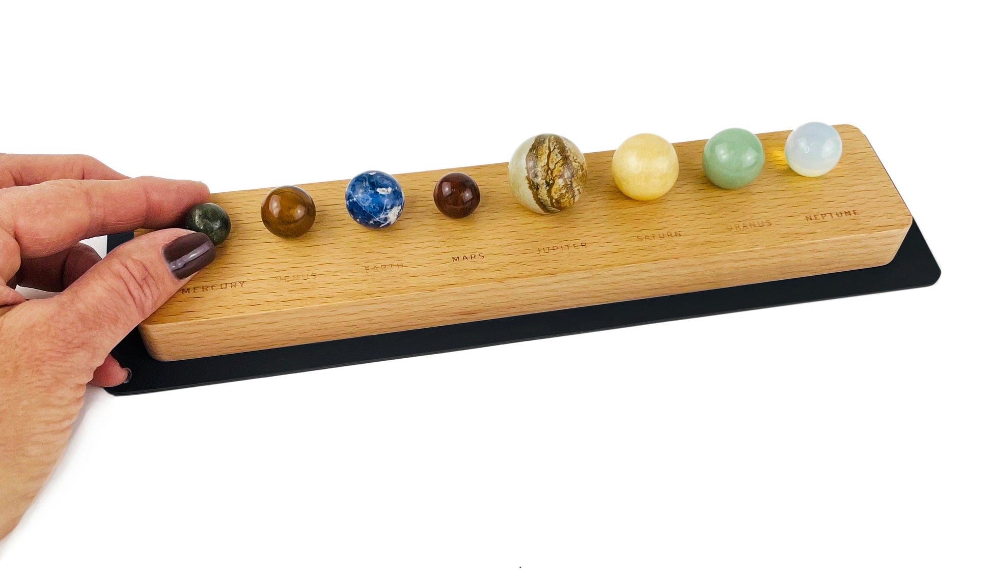 Stone Planets made of stone on a wood holder 