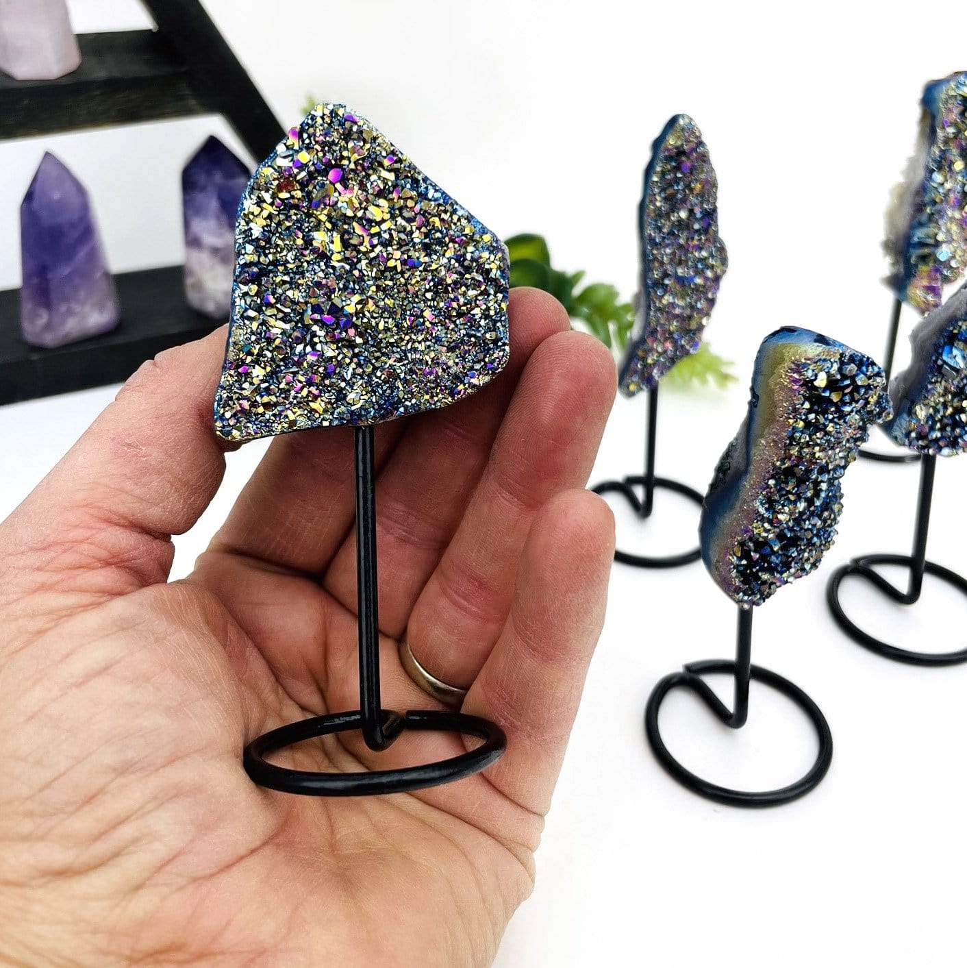 crystal cluster in hand for size reference 