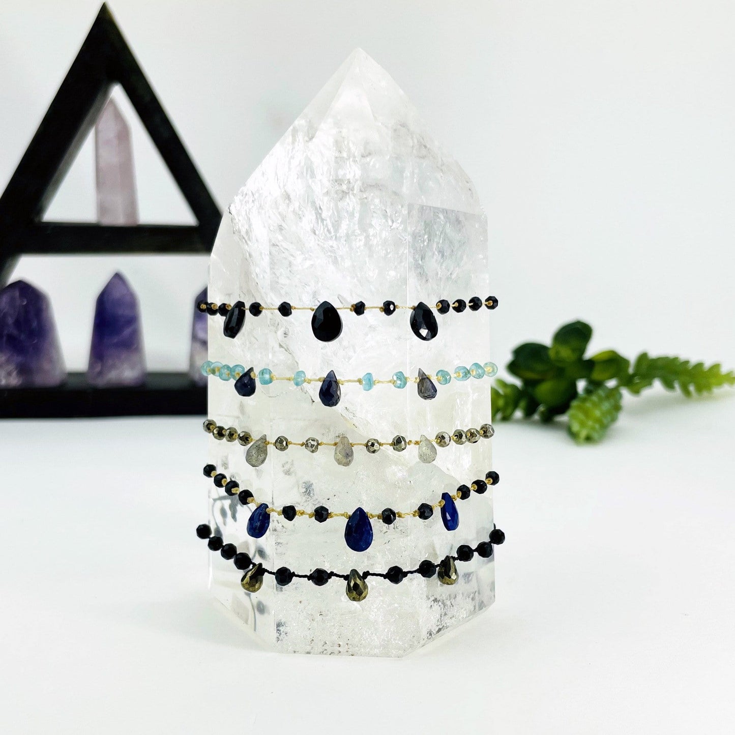 stone beaded bracelets on a point