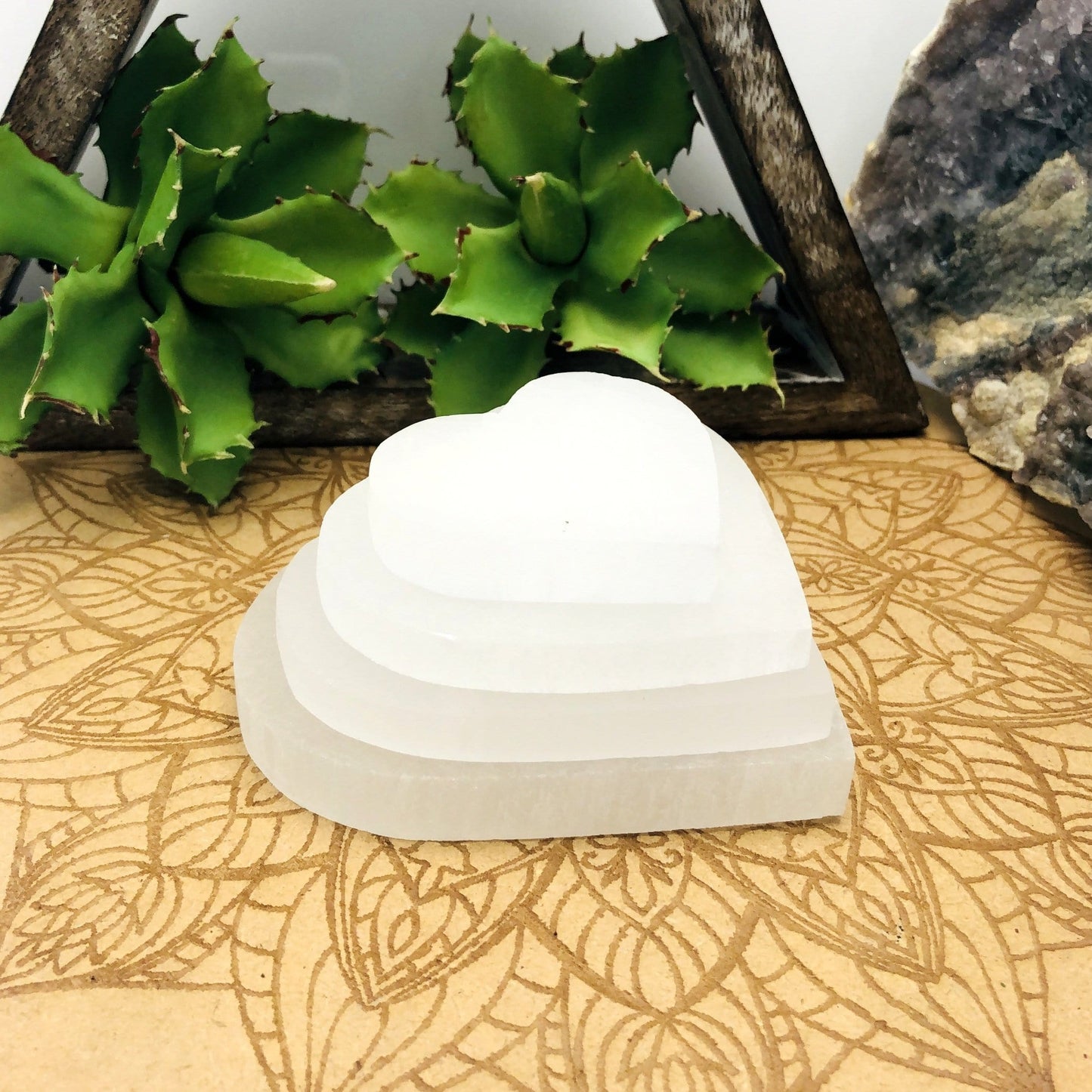 selenite flat heart sizes stacked for size comparison 