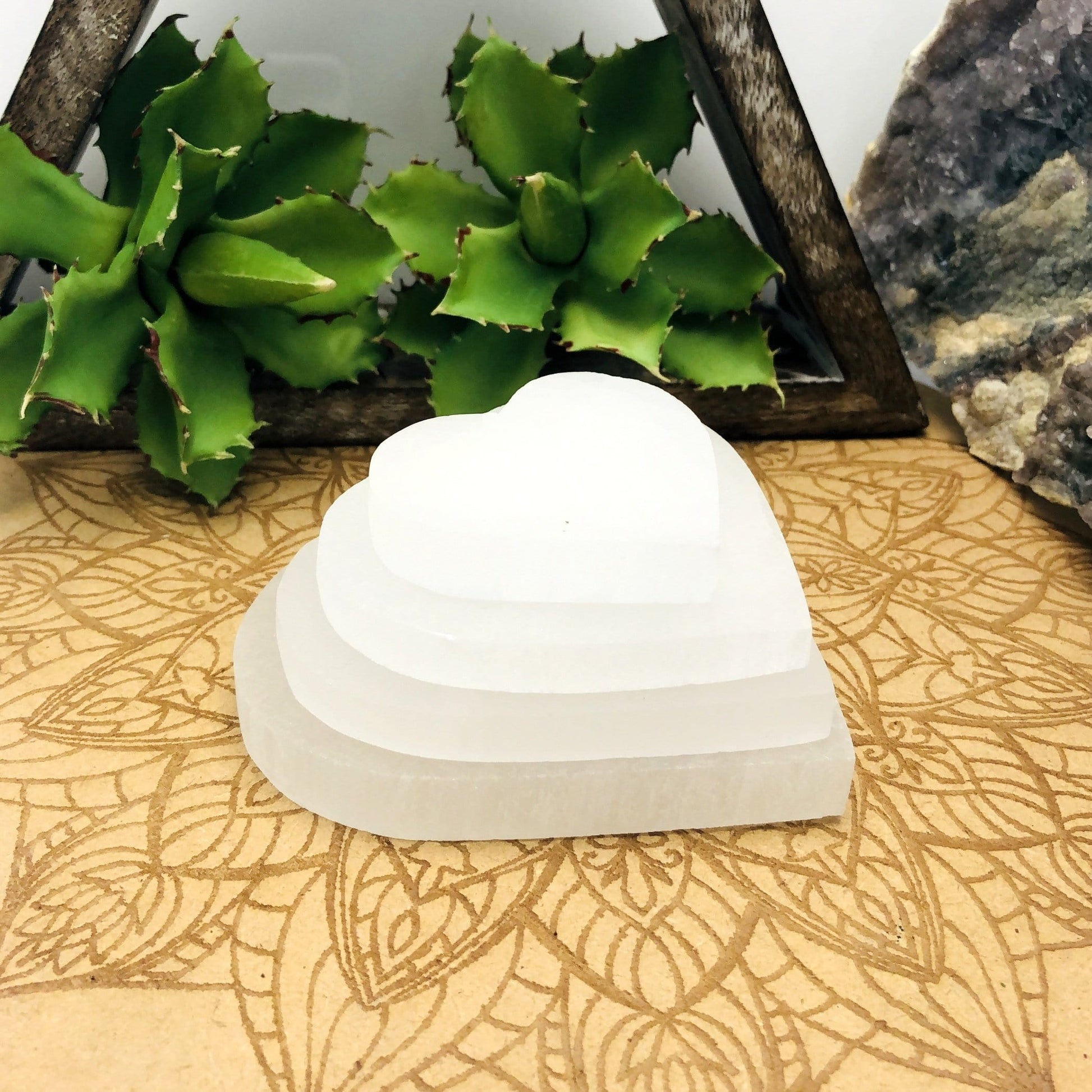 selenite flat heart sizes stacked for size comparison 