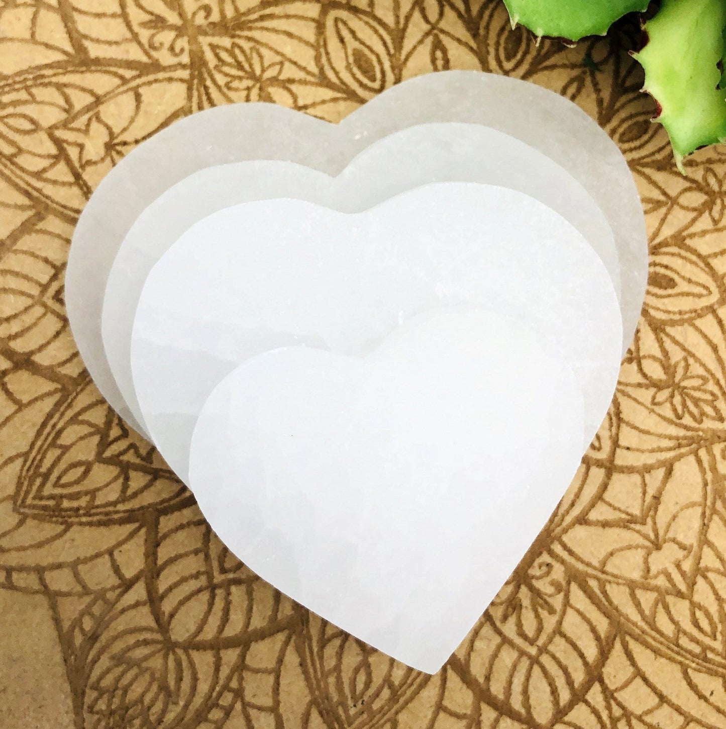 selenite flat heart sizes stacked for size comparison 