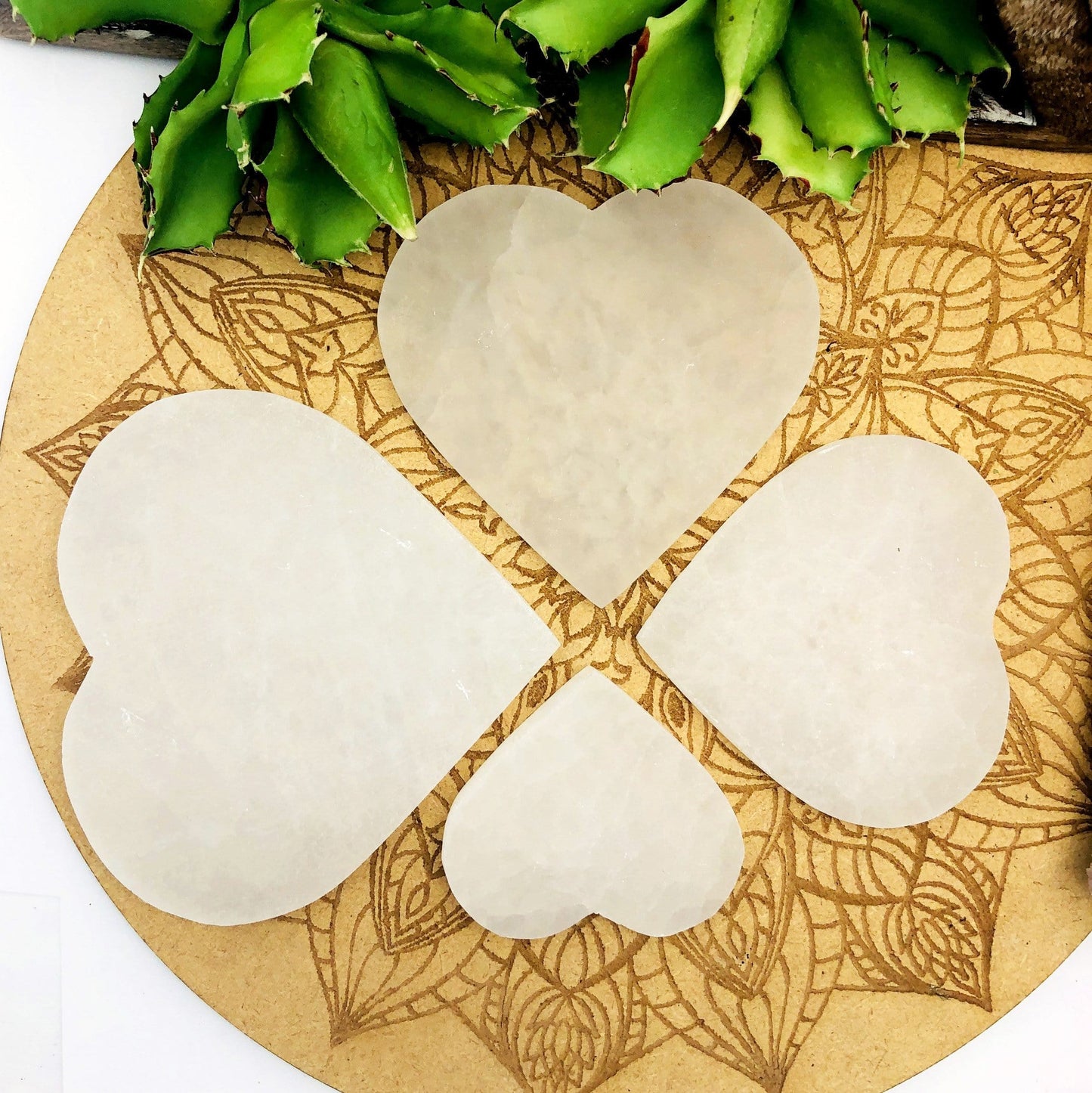 all selenite flat heart sizes on display for size comparison 