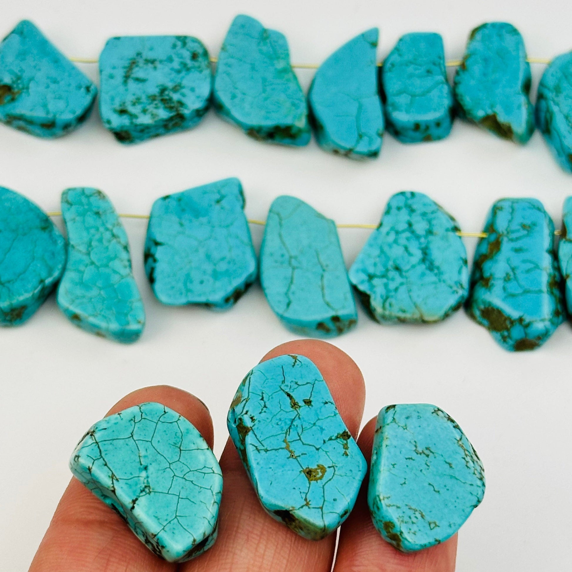 close up of the details on these turquoise crystal beads 