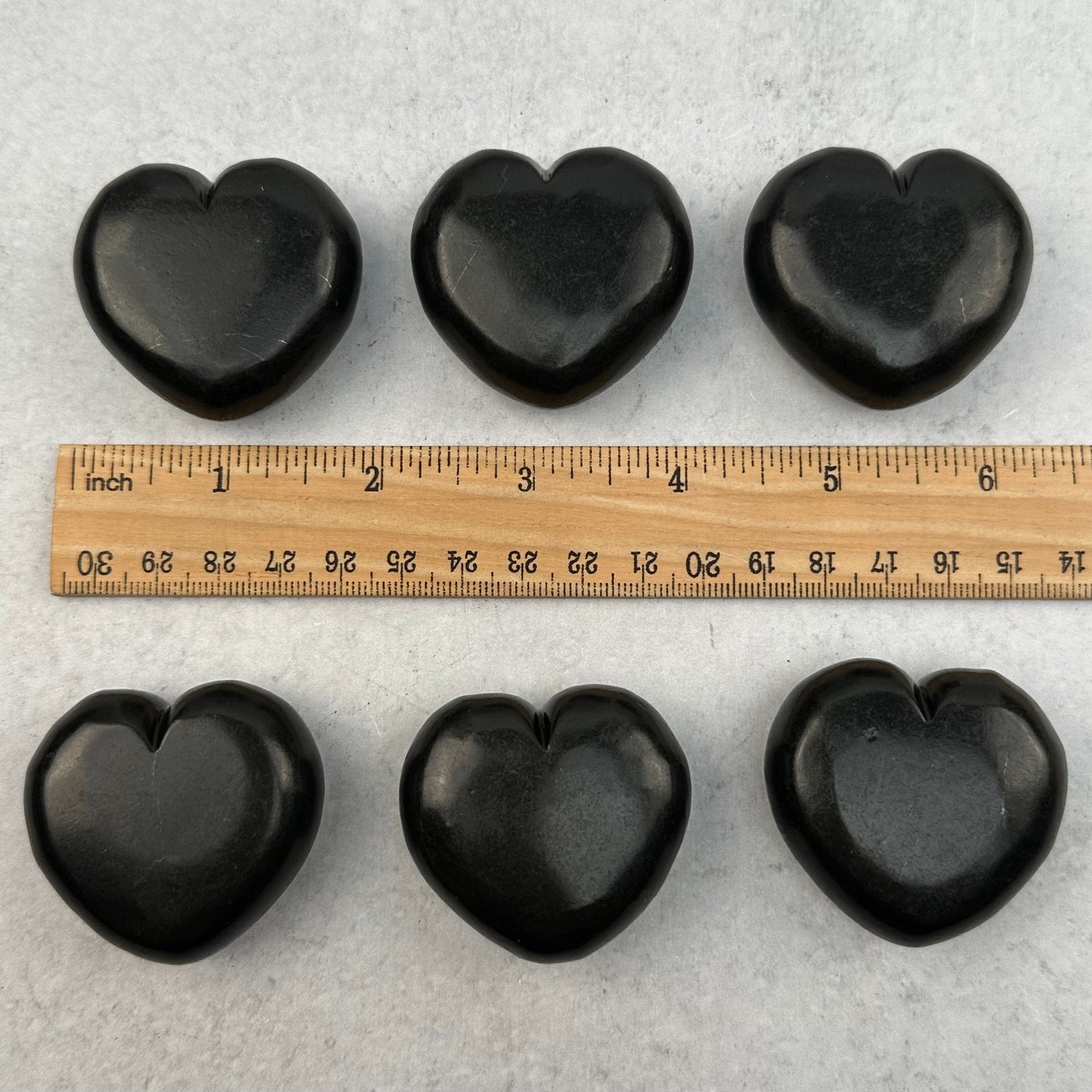 hearts next to a ruler for size reference 