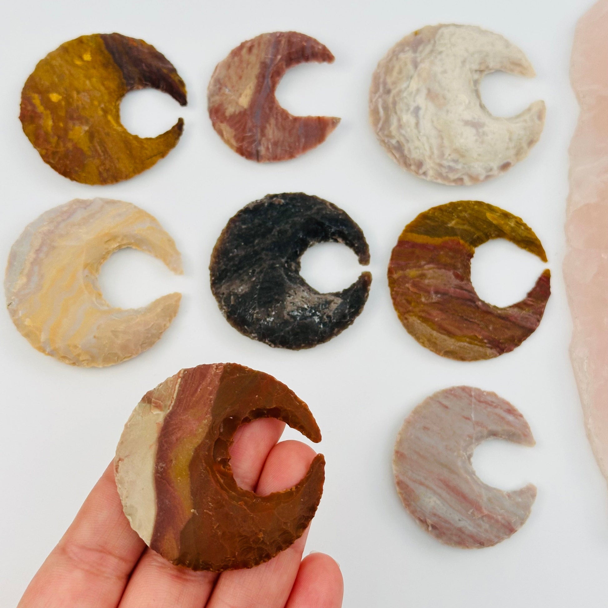 raw jasper moon crescent in hand for size reference 