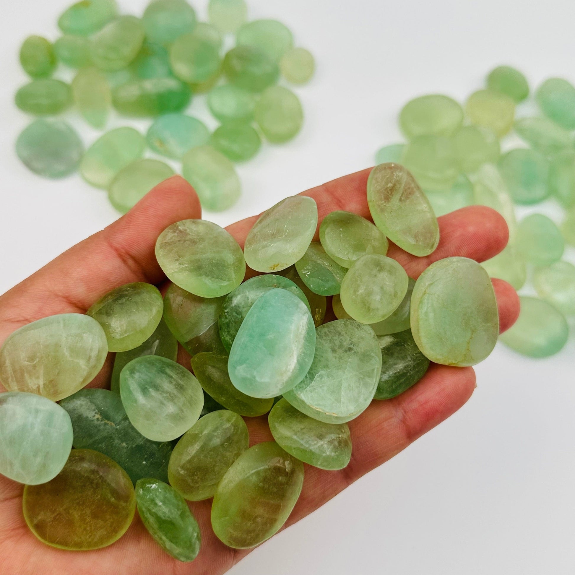 tumbled stones in hand for size reference 