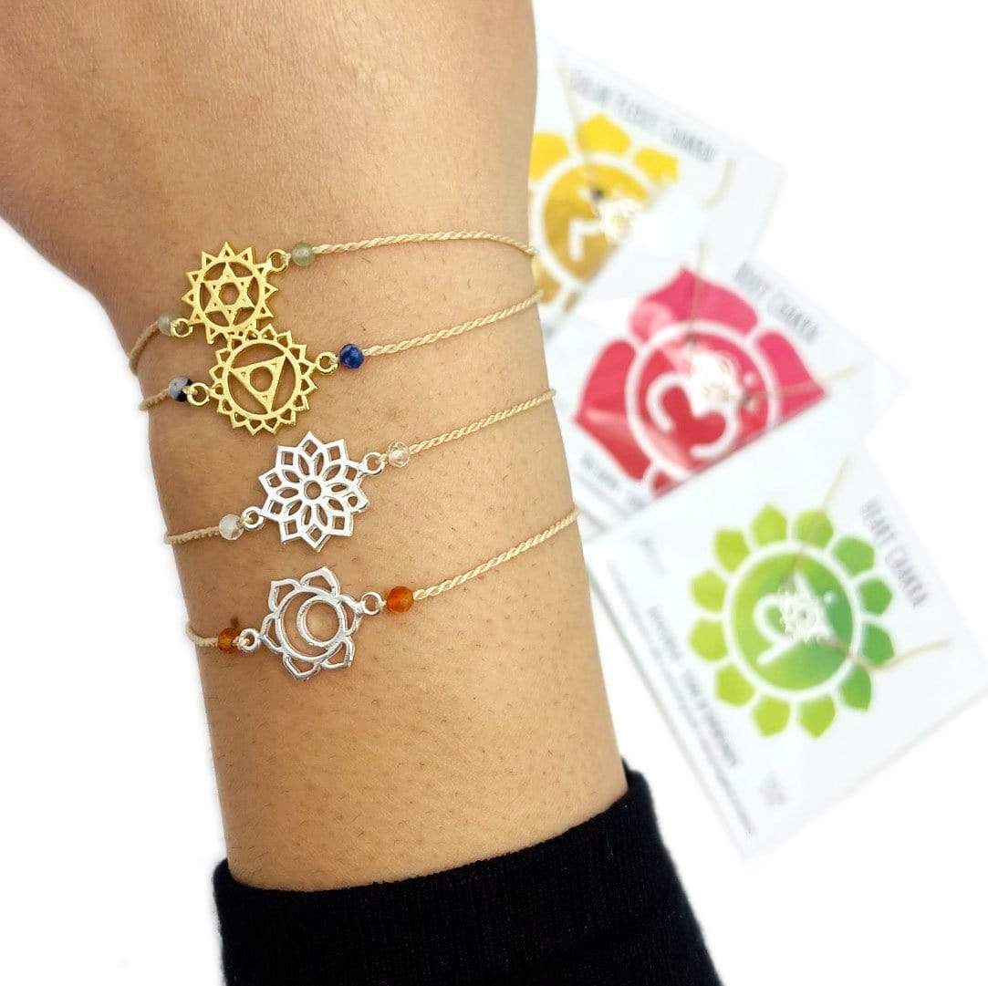 charka bracelets in gold and silver on wrist for size reference 