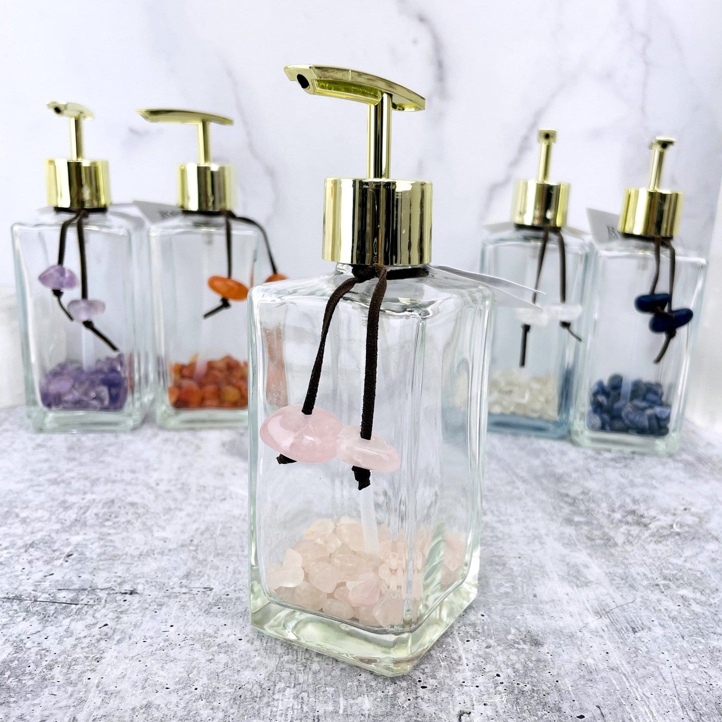 Rose Quartz tumbled stone soap dispenser up close