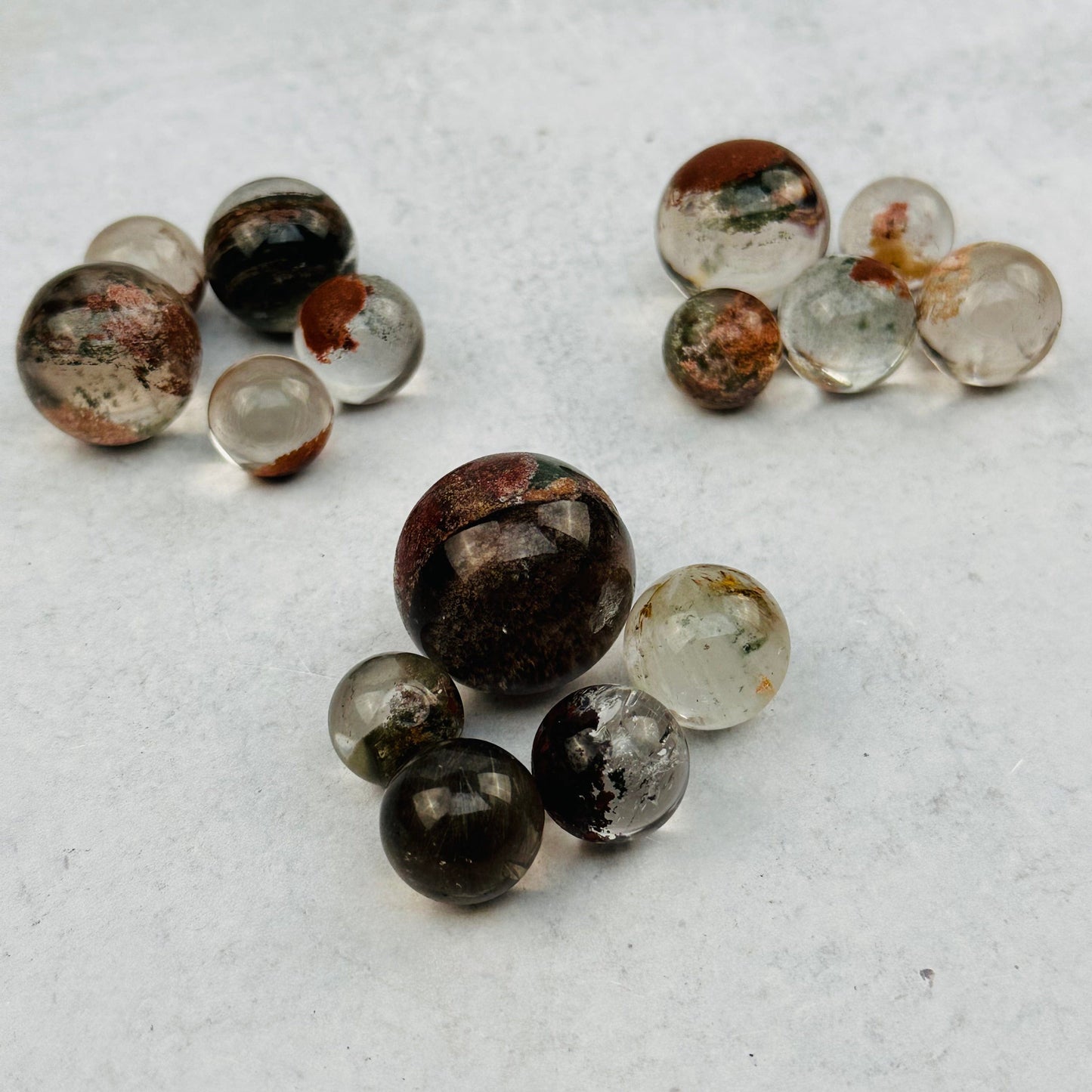 multiple spheres displayed to show the differences in the sizes and color shades 