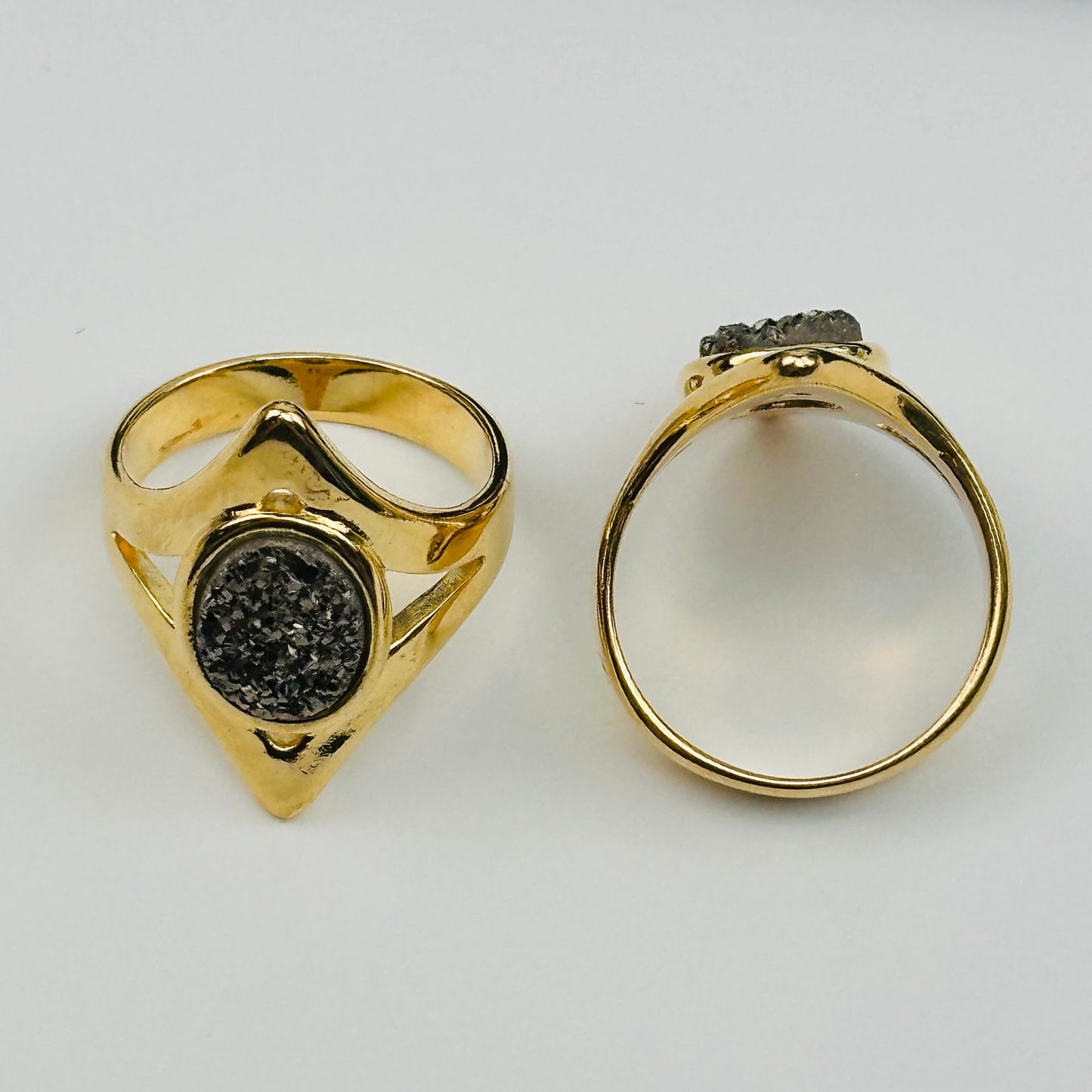 top view of the details on these black diamond druzy rings 