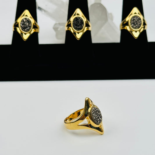multiple Oval Black Diamond Titanium Crystal Rings displayed to show the differences in the druzy style 