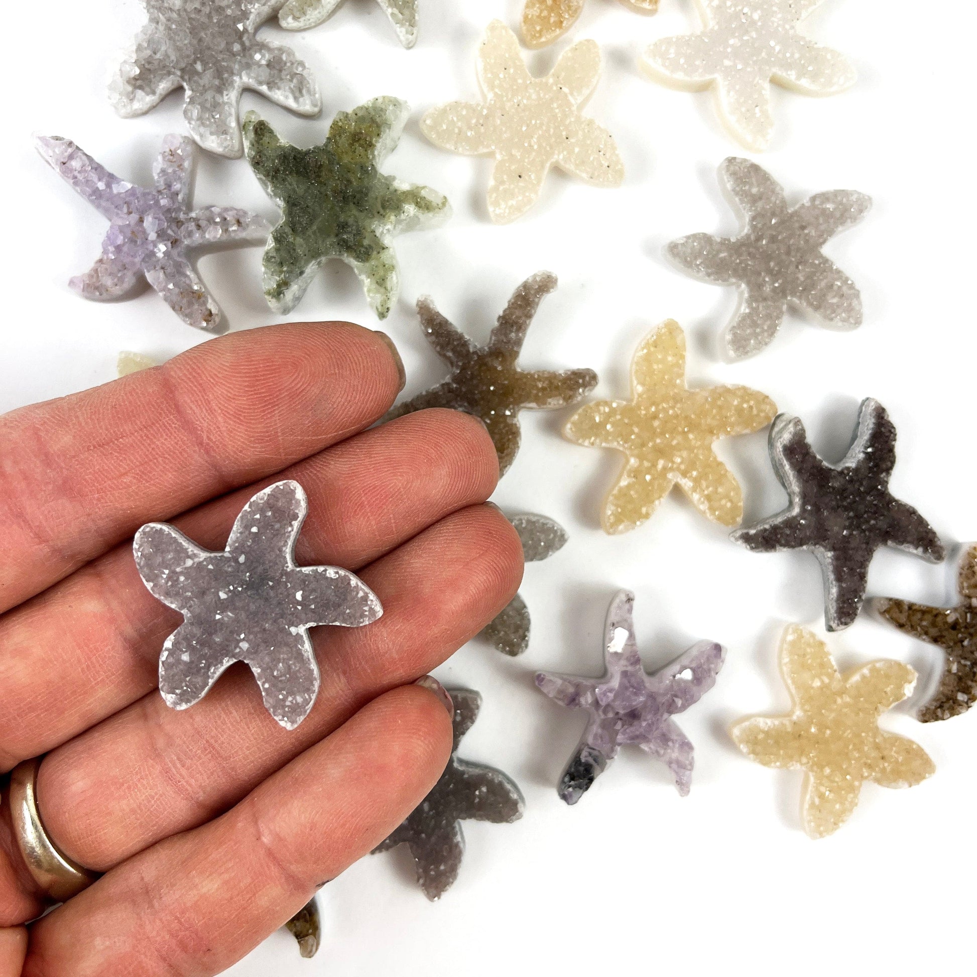 Druzy 30mm Starfish Shaped Cabochon in a hand for size reference
