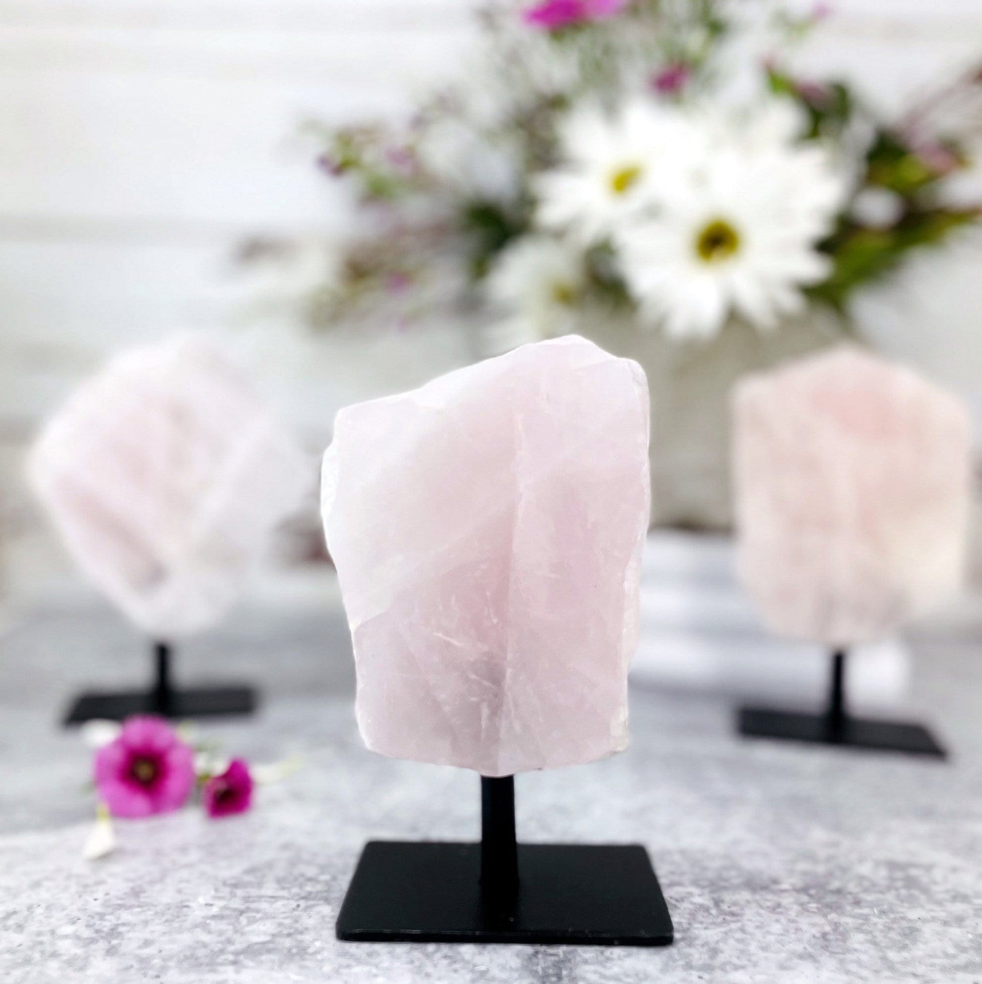 rose quartz on a metal stand