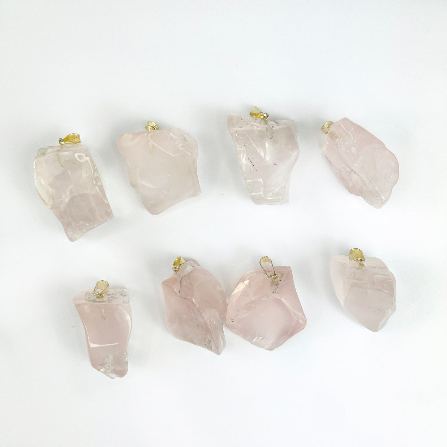 8 Crystal Rose Quartz Polished Free Form Pendant with Silver Bails showing shape variances