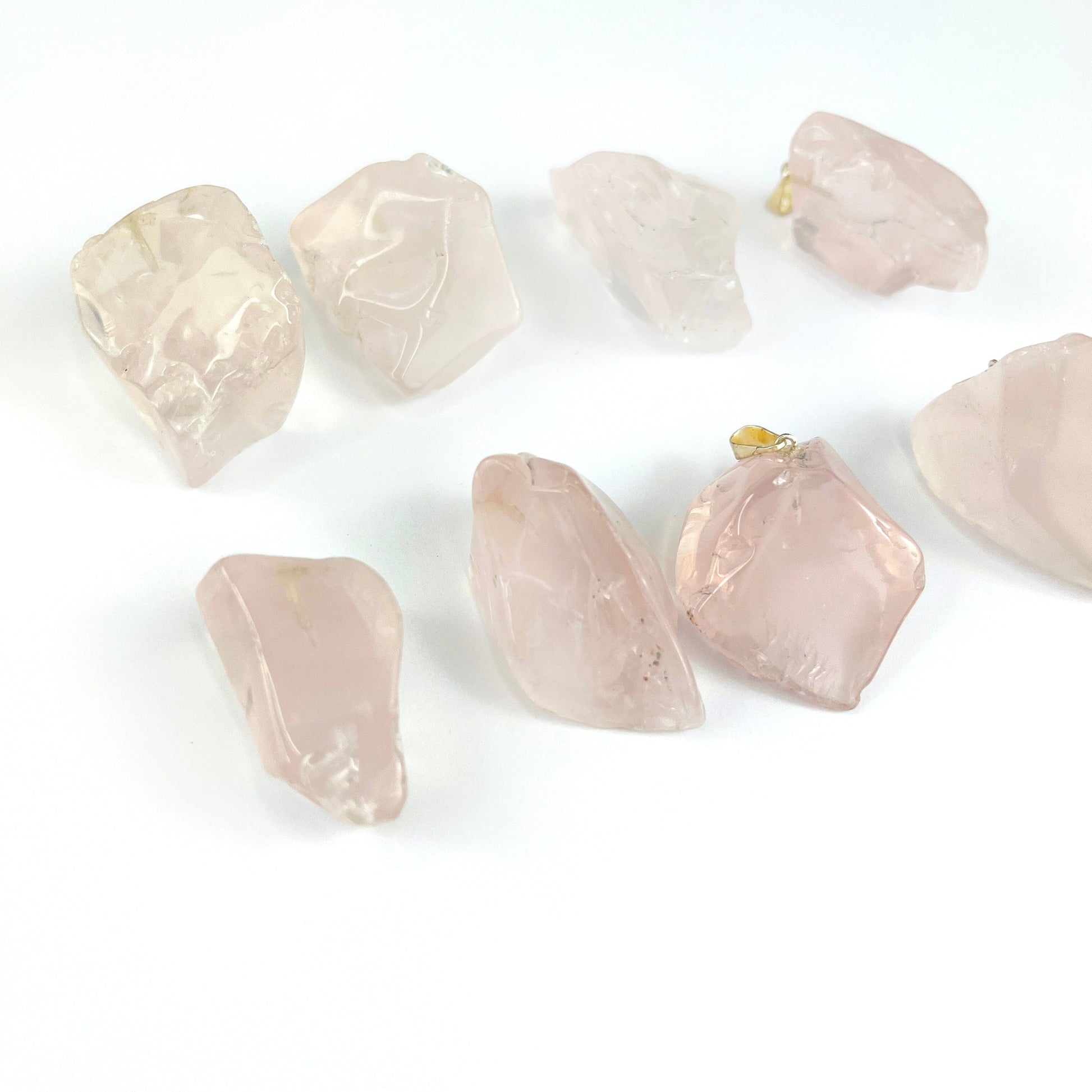 Crystal Rose Quartz Polished Free Form Pendants with Silver Bails shown from a side view to show thickness