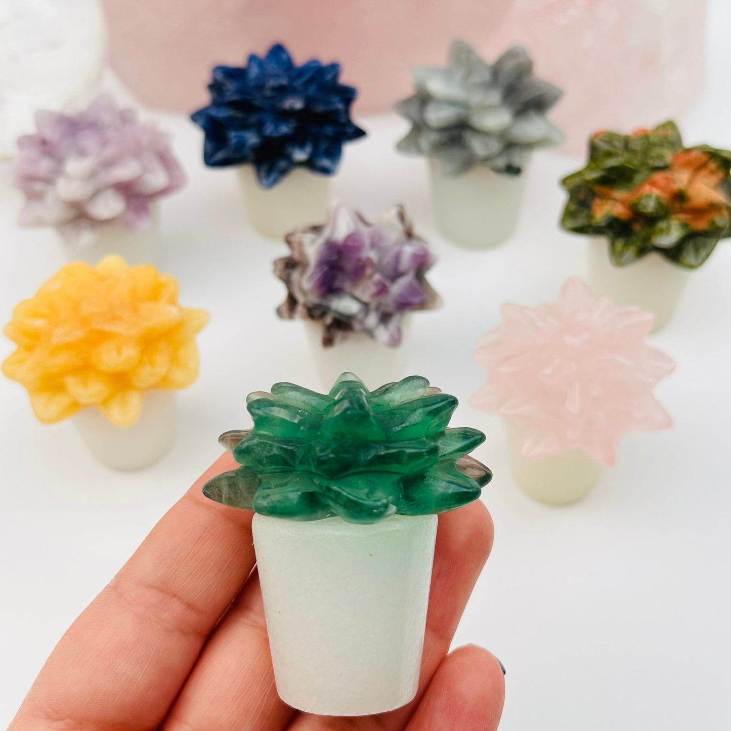 Carved Crystal Succulent in Pot on hand for size reference 