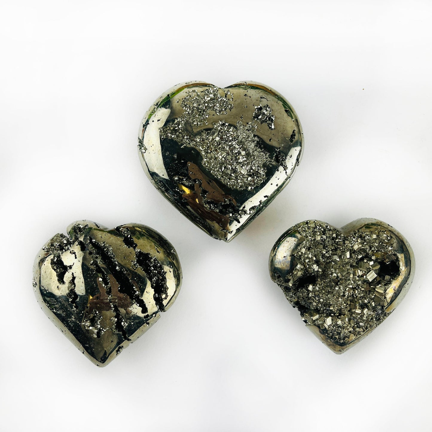 3 Pyrite Crystal Hearts on white table