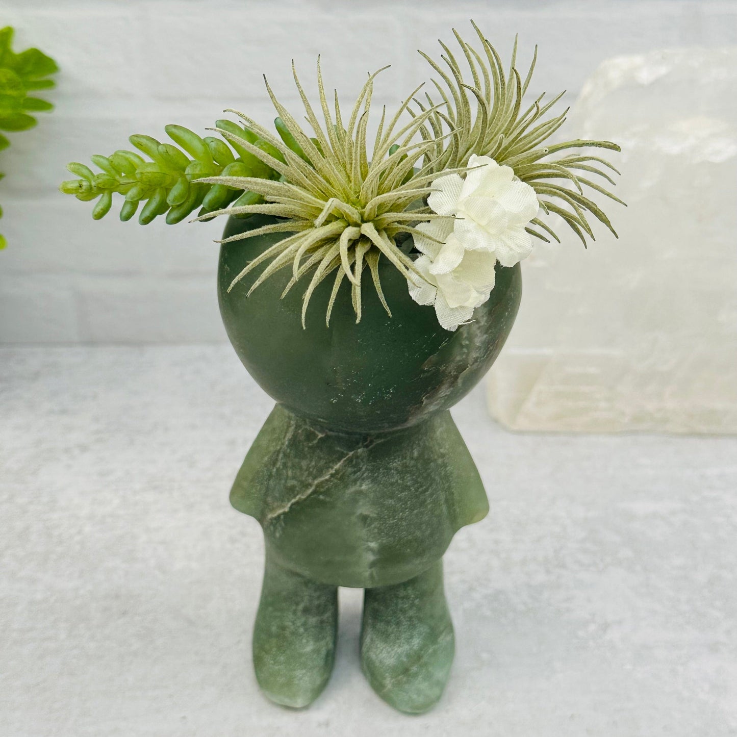 Carved Gemstone Plant Person displayed as home decor 