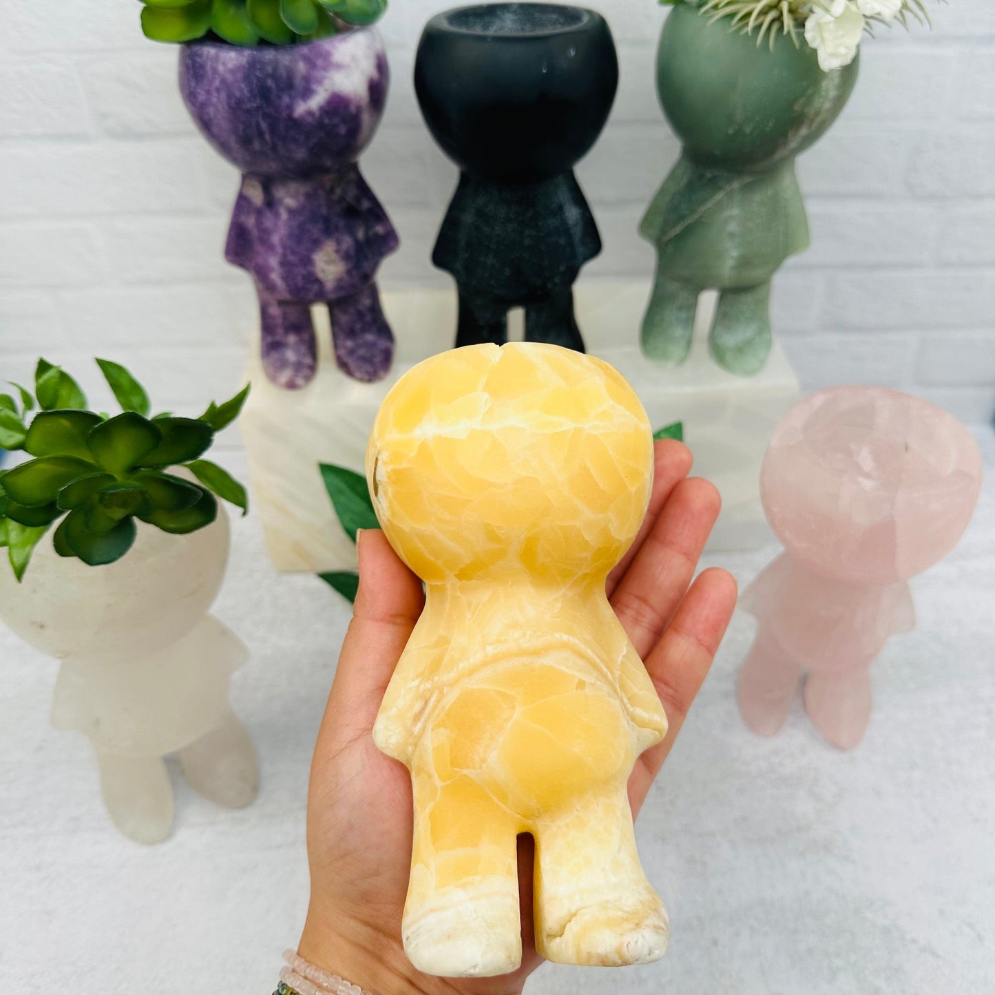 Carved Gemstone Plant Person in hand for size reference 