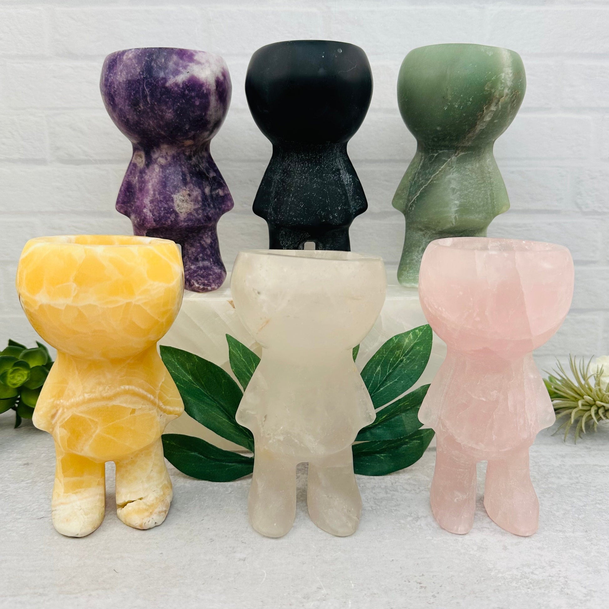 multiple Carved Gemstone Plant holders displayed to show the differences in the gemstone types