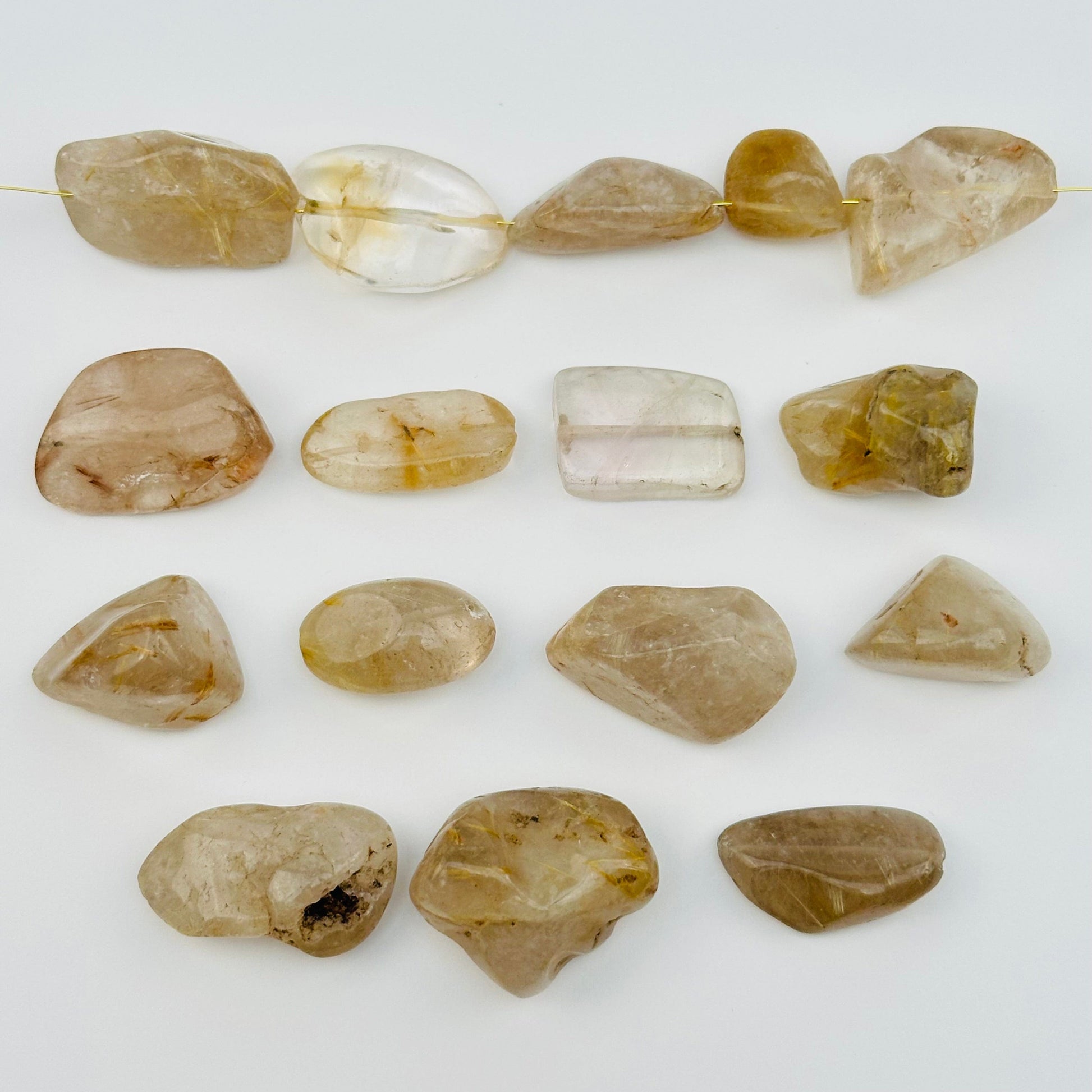 multiple beads displayed to show the differences in the sizes and color shades 