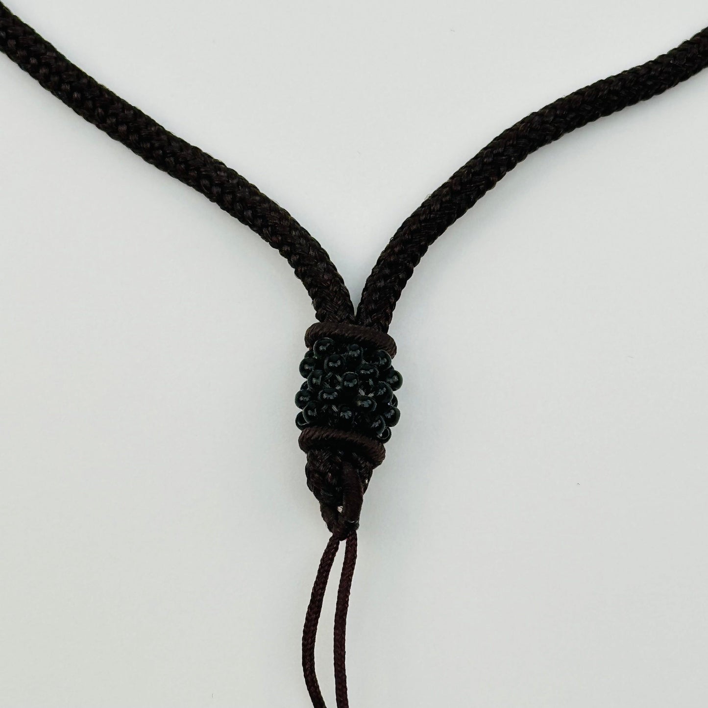 close up of the beaded details on the bottom of the necklace 