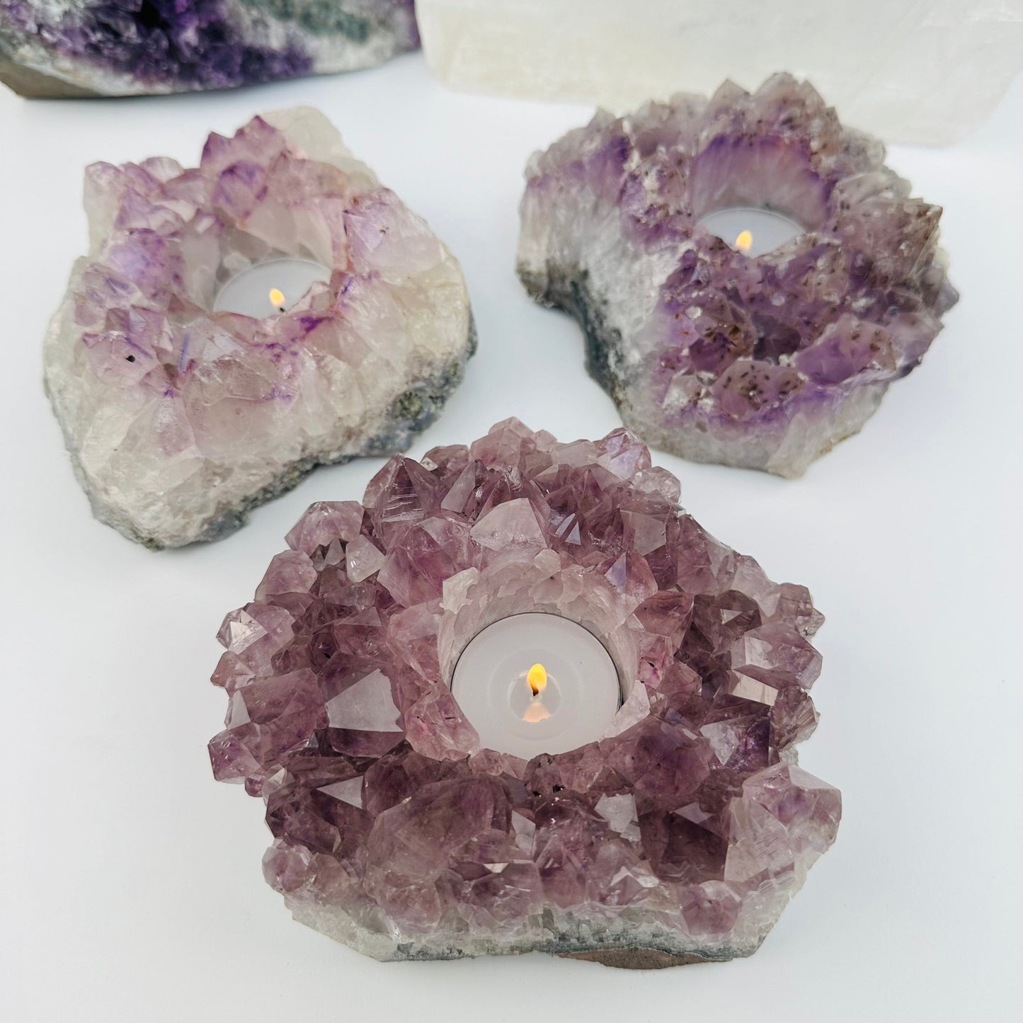 multiple candle holders displayed to show the differences in the sizes and color shades 