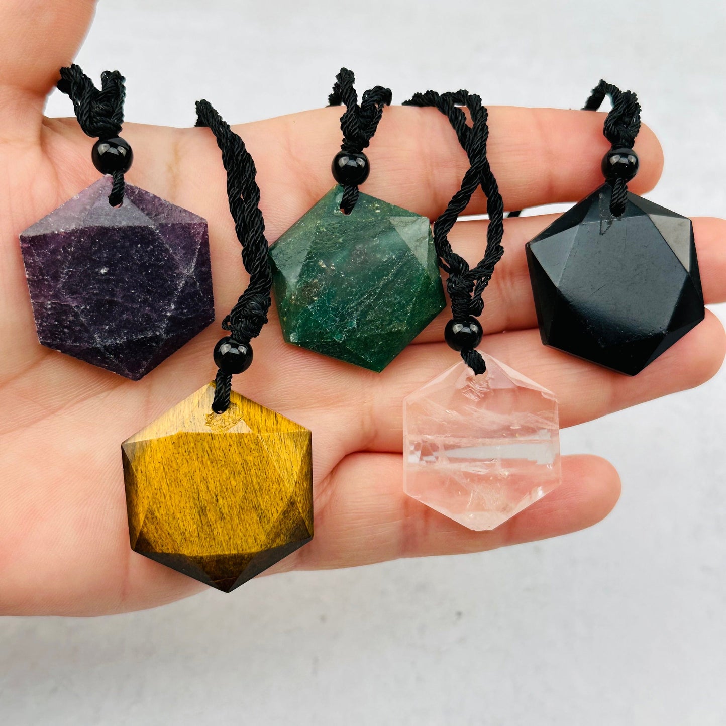 necklaces in hand for size reference 