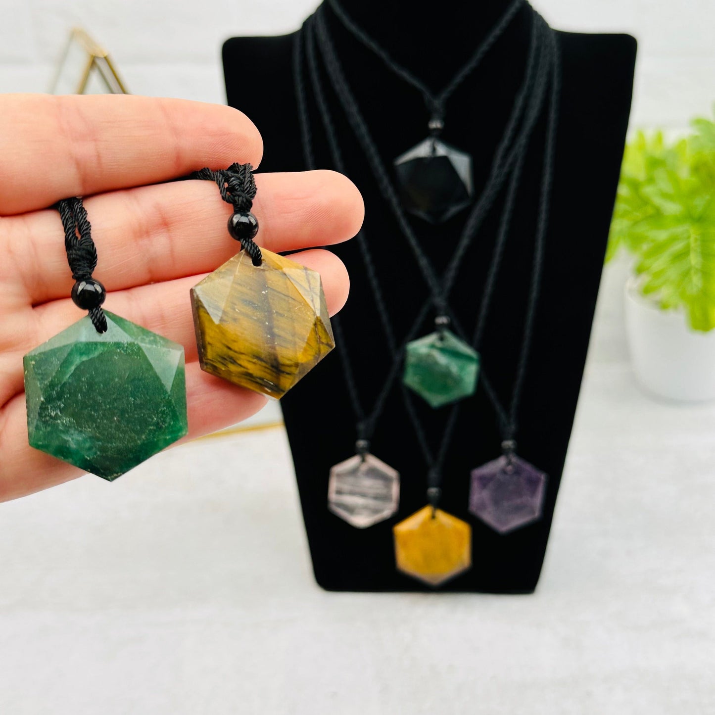 Hexagon Pendants on Black Cord Necklace - Star of David in hand for size reference 