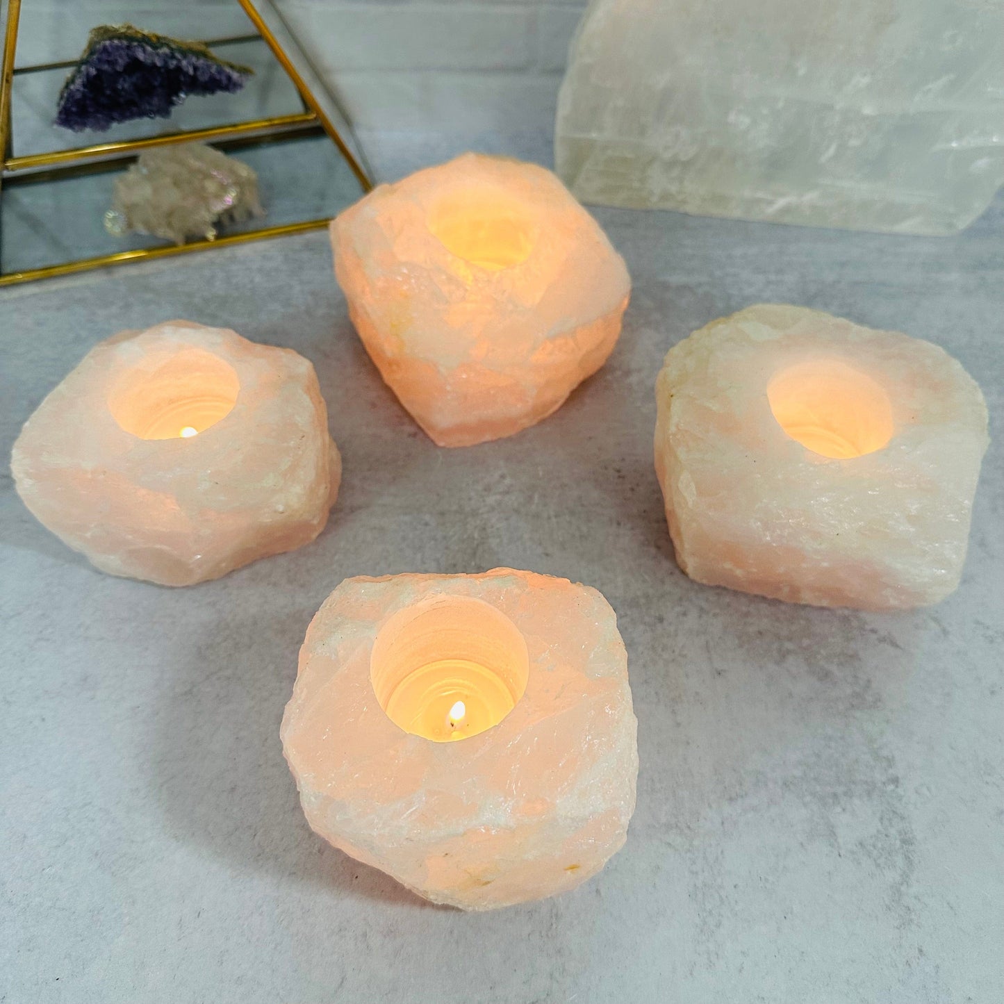 multiple candle holders displayed to show the differences in the color shades and sizes 