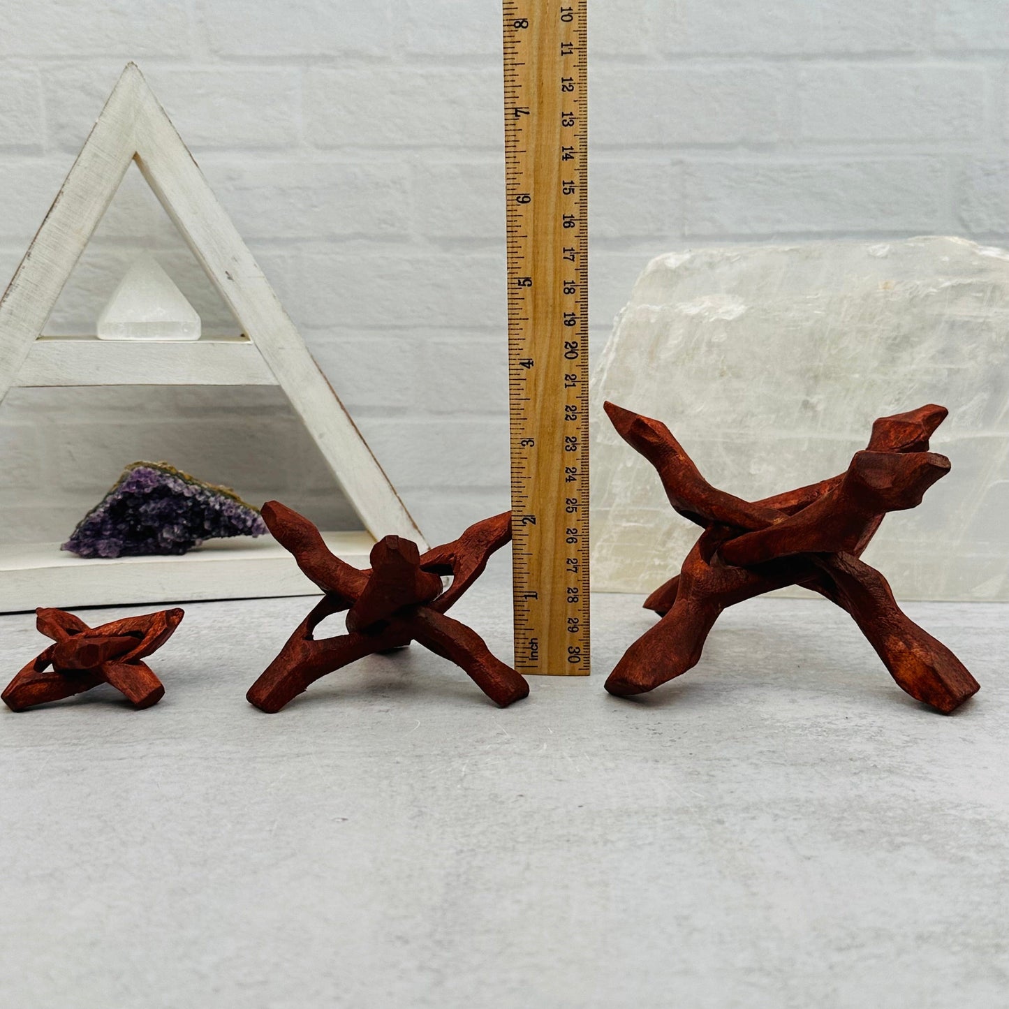Wood Cobra Sphere Stand next to a ruler for size reference 