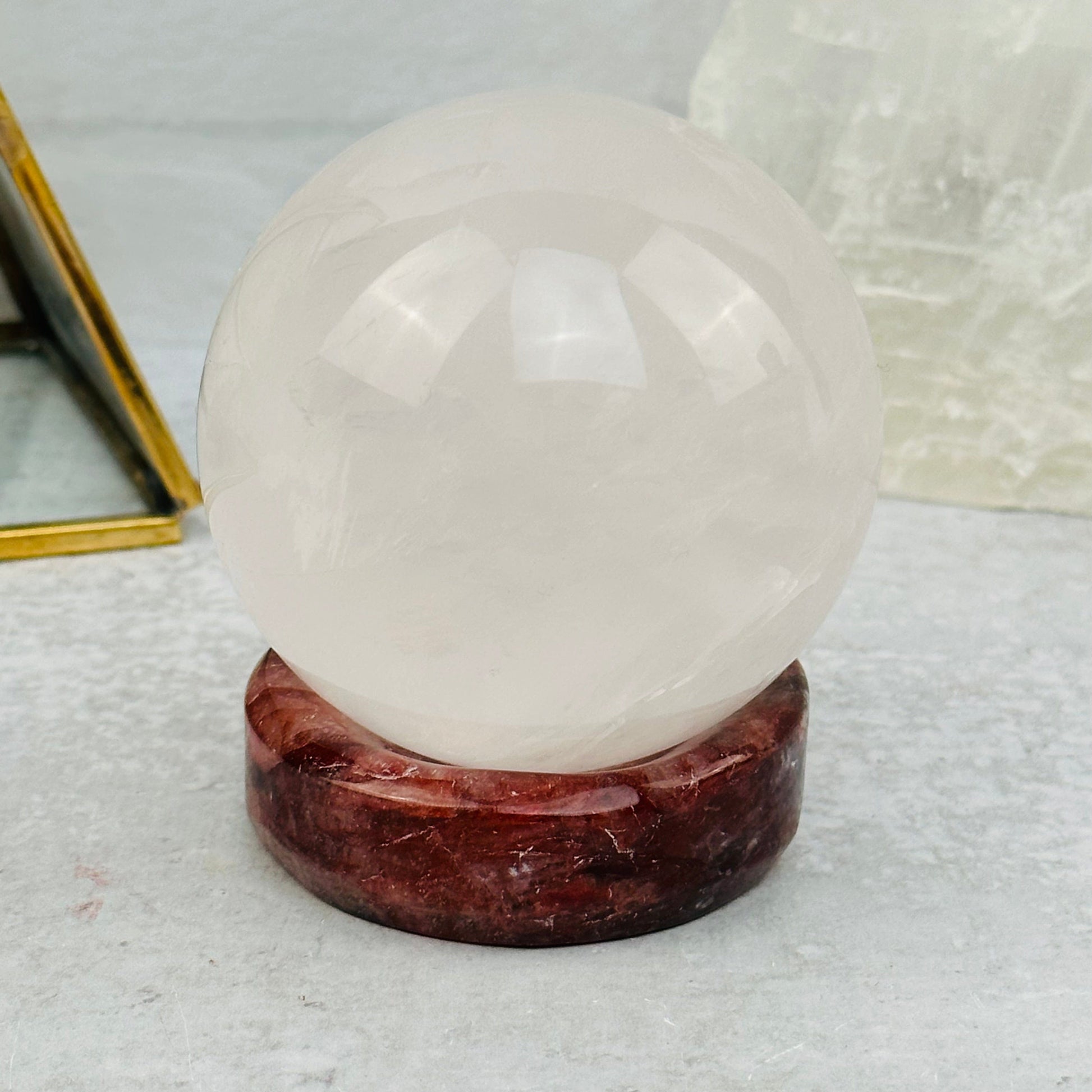 Fire Quartz Sphere Stand displayed as home decor 