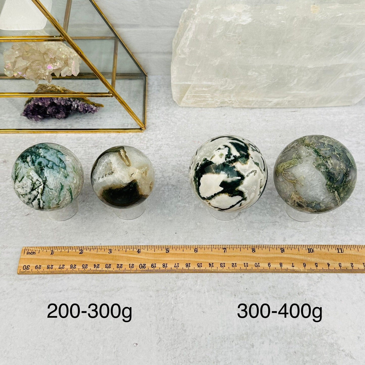 Moss Agate Spheres - By Weight - next to a ruler for size reference 
