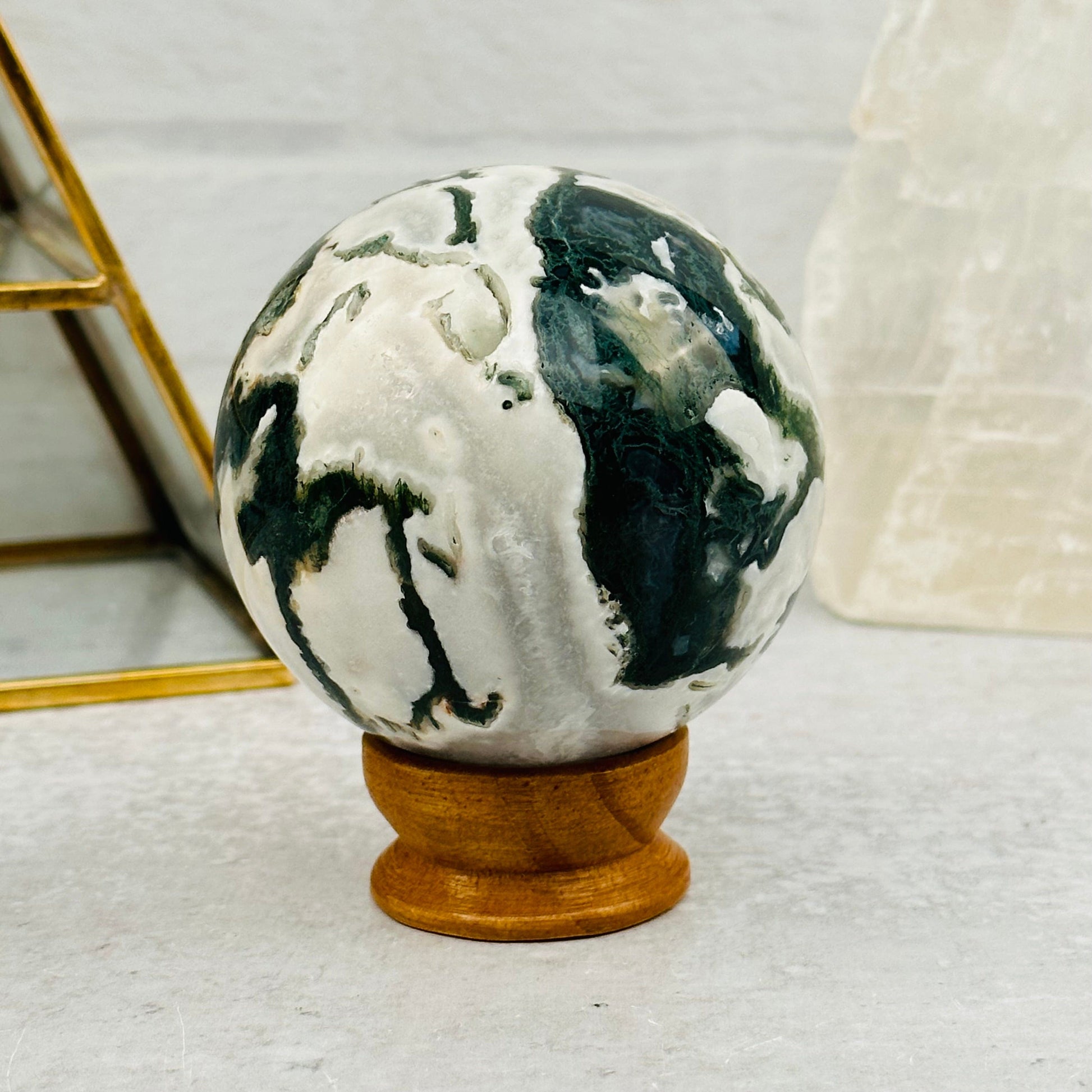 Moss Agate Sphere displayed as home decor 