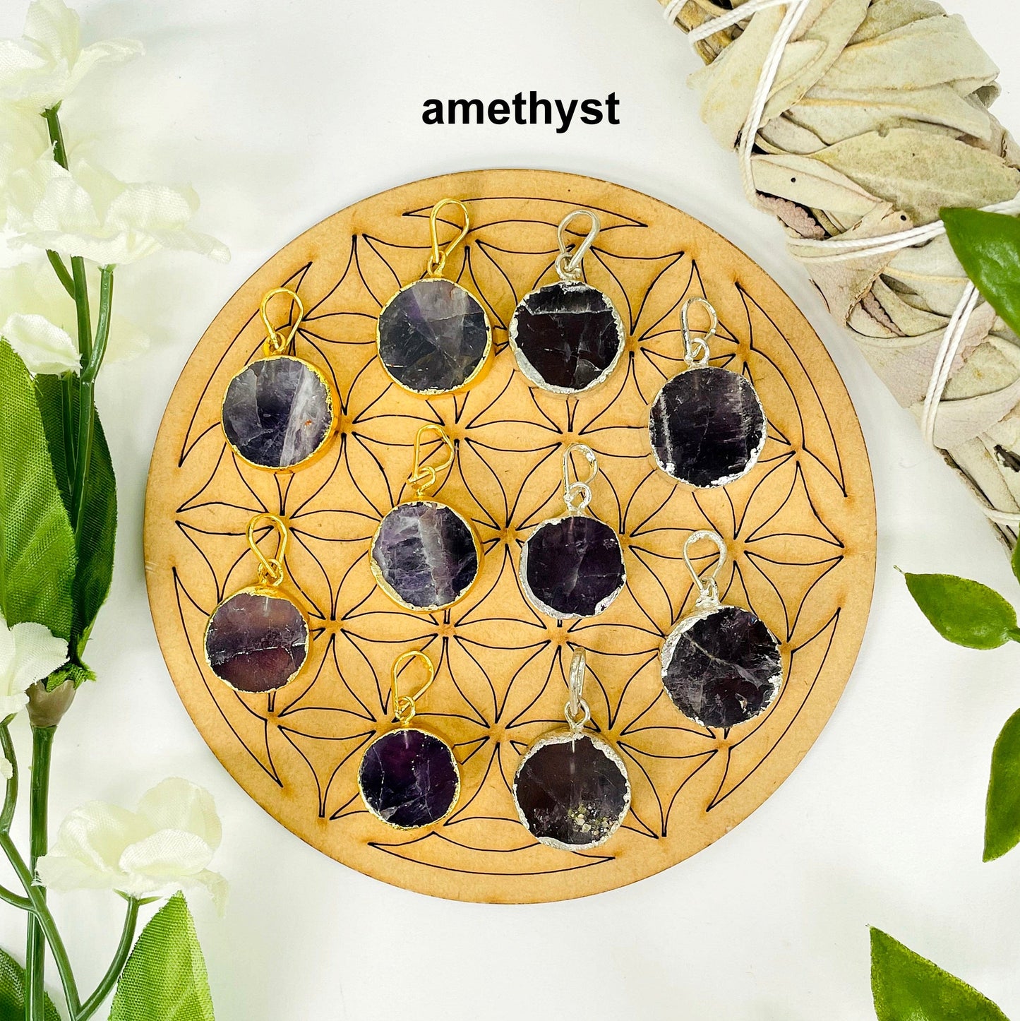  overhead view of five gold and five silver round amethyst pendants on display with decorations for possible variations and finish comparison 