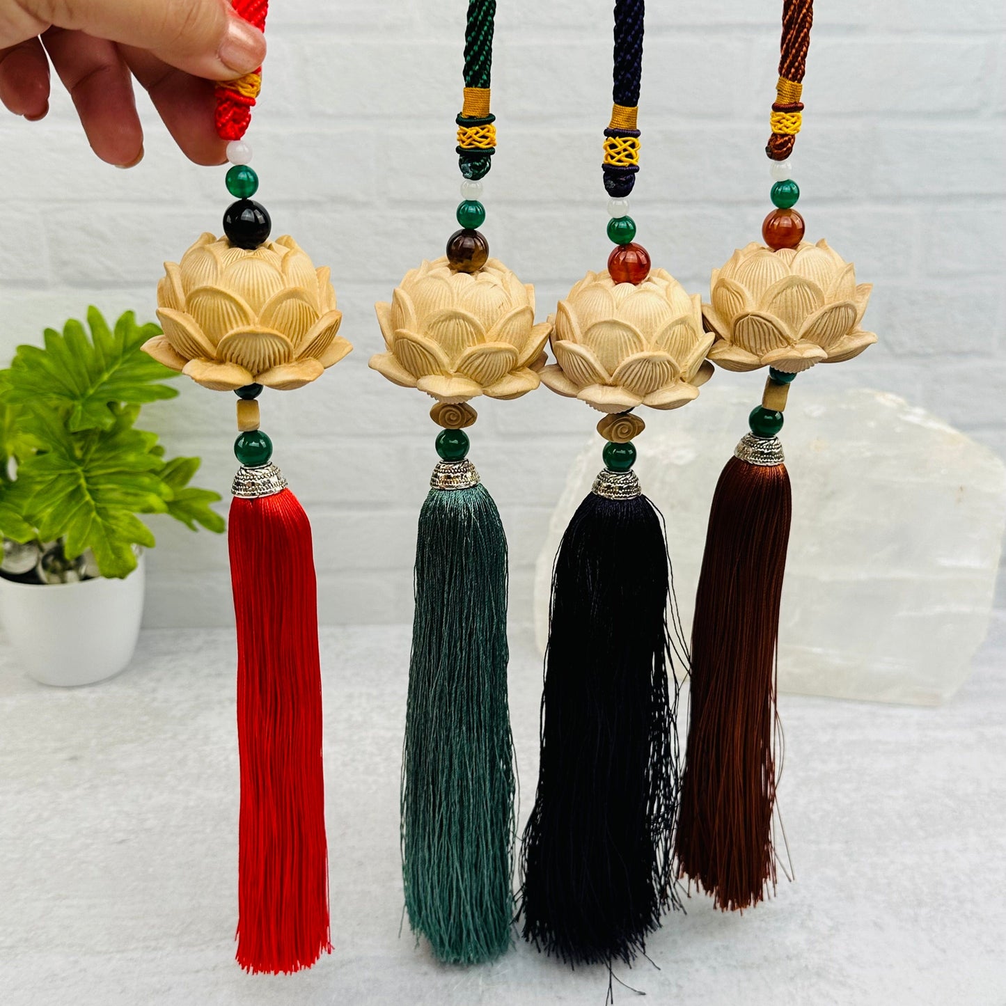wooden lotus flower tassel with decorations in the background