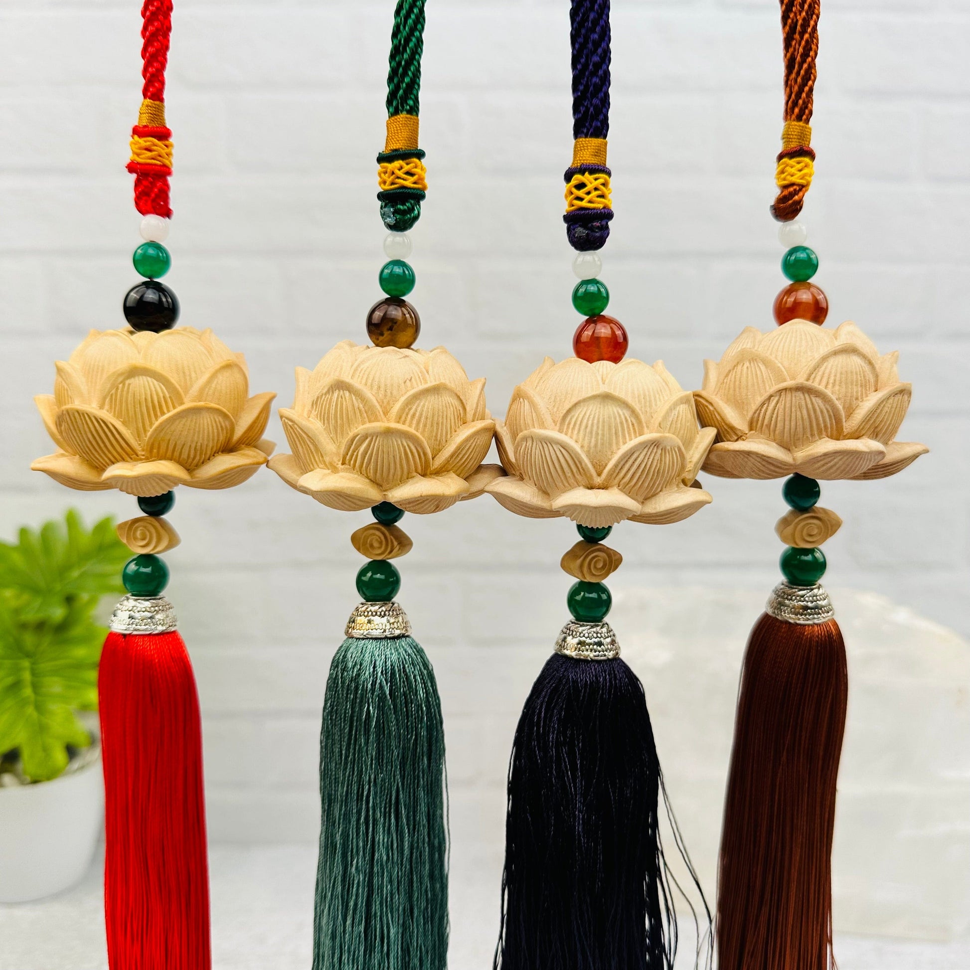 wooden lotus flower tassel with decorations in the background