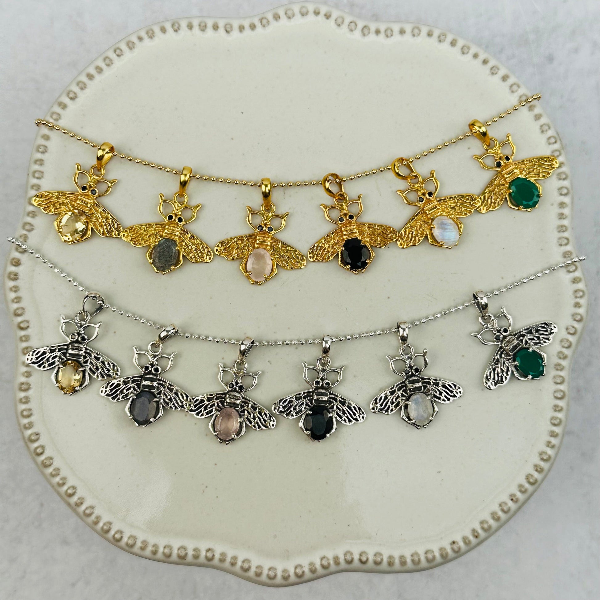 crystal bee pendants with decorations in the background