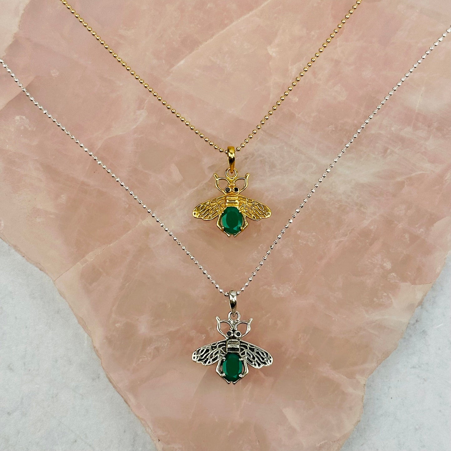 crystal bee pendants with decorations in the background