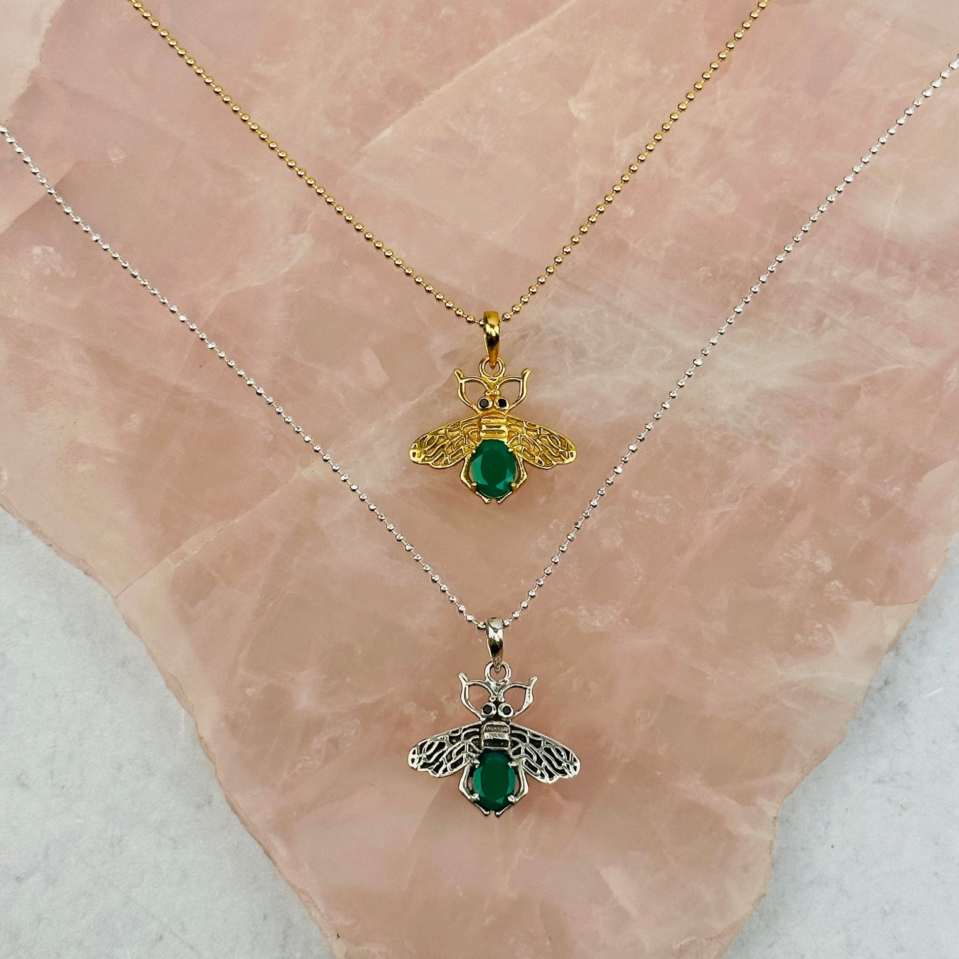 crystal bee pendants with decorations in the background