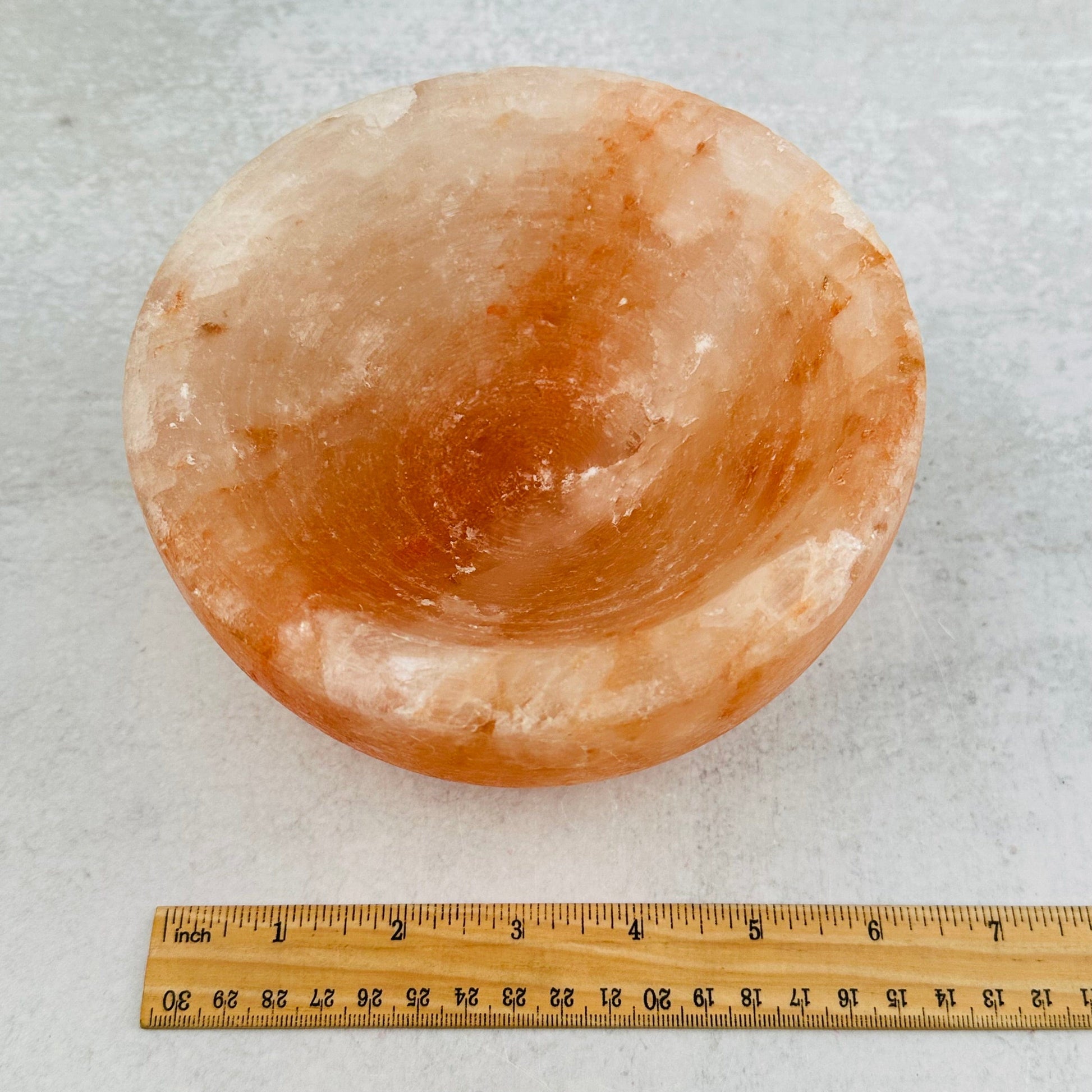 Himalayan Salt Bowl next to a ruler for size reference 