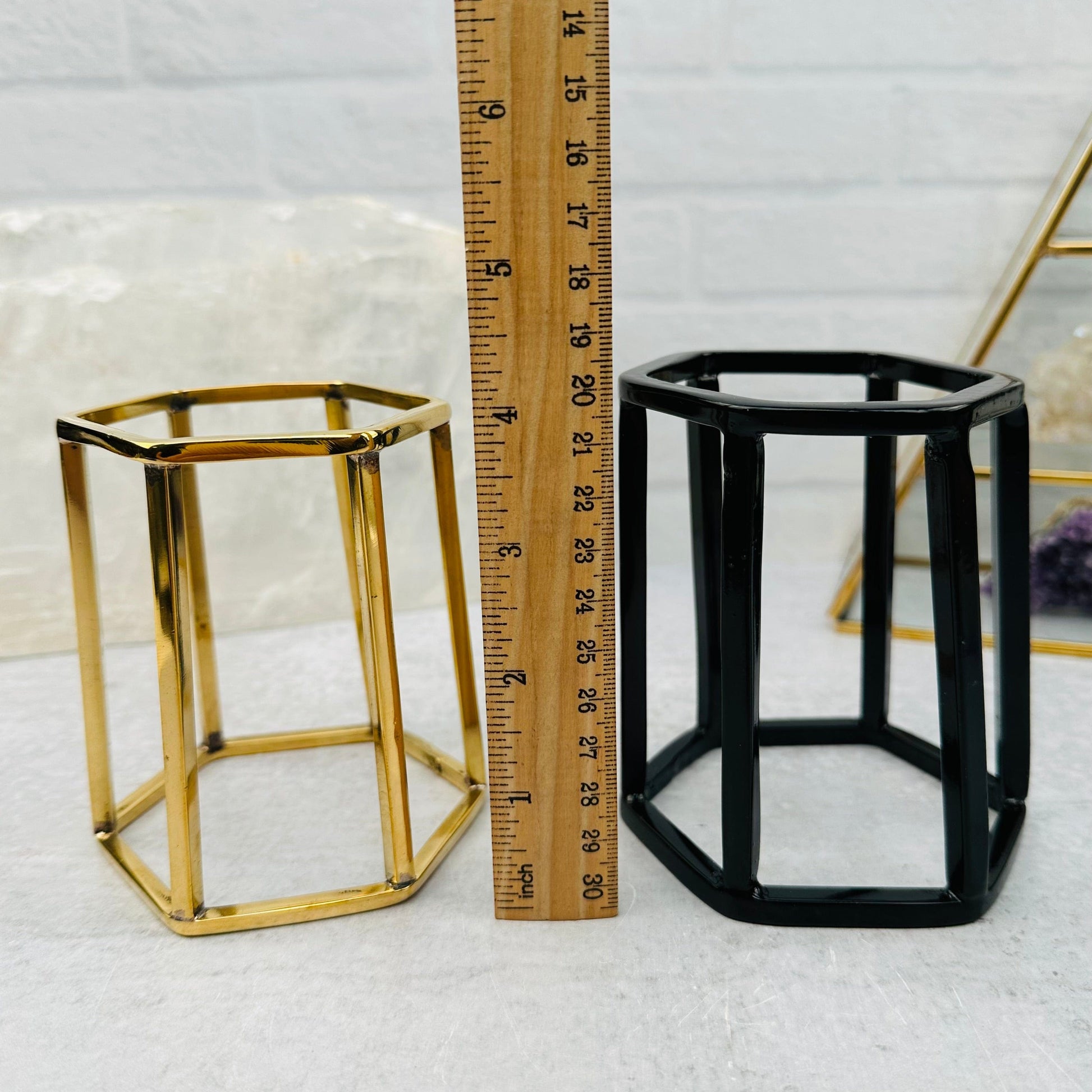 crystal stand next to a ruler for size reference 