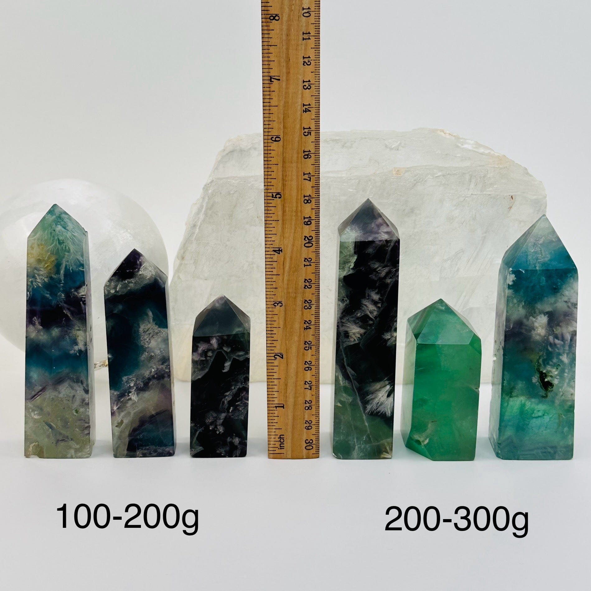  Rainbow Feathered Fluorite Crystal Polished Point Towers - By Weight - next to a ruler for size reference 