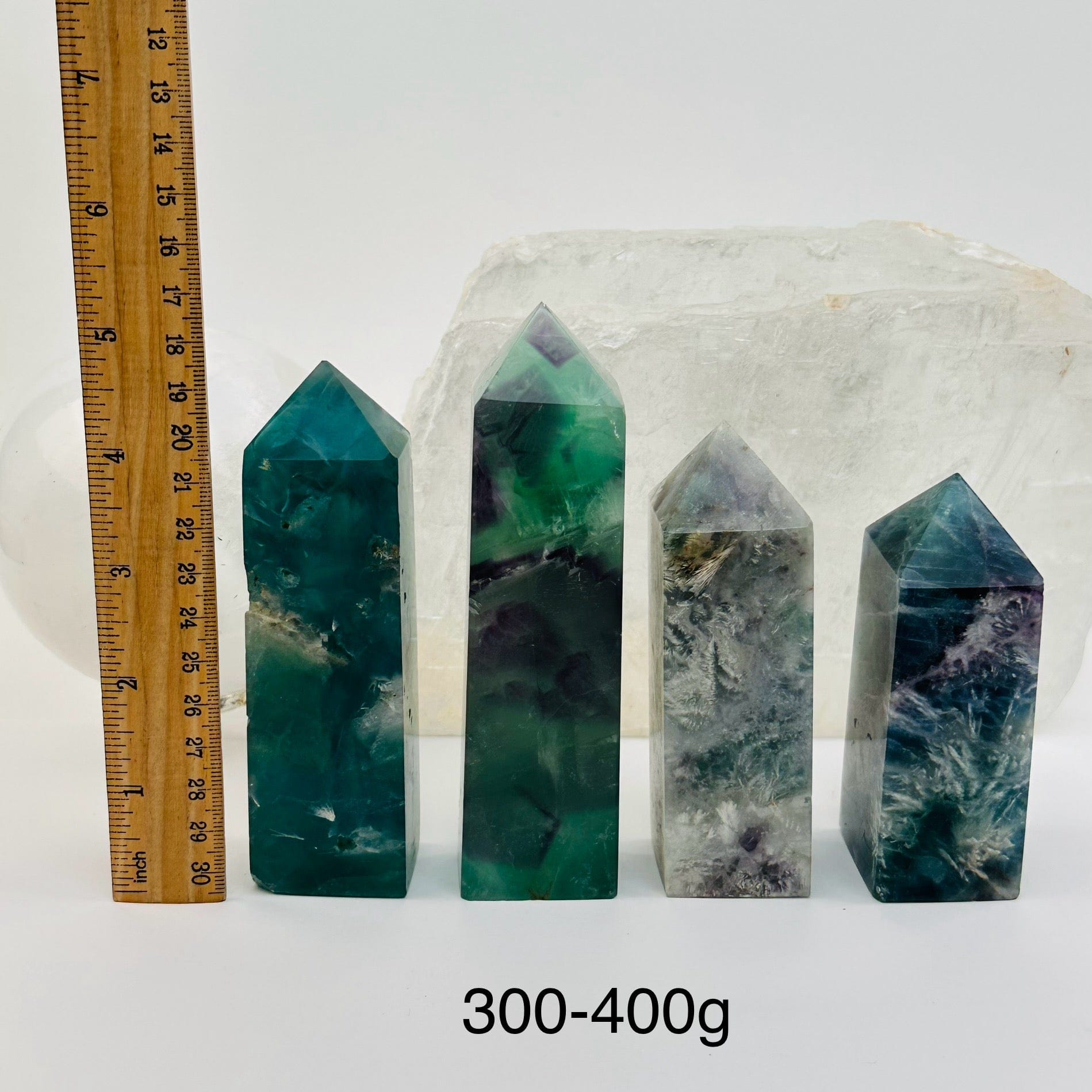  Rainbow Feathered Fluorite Crystal Polished Point Towers - By Weight - next to a ruler for size reference 
