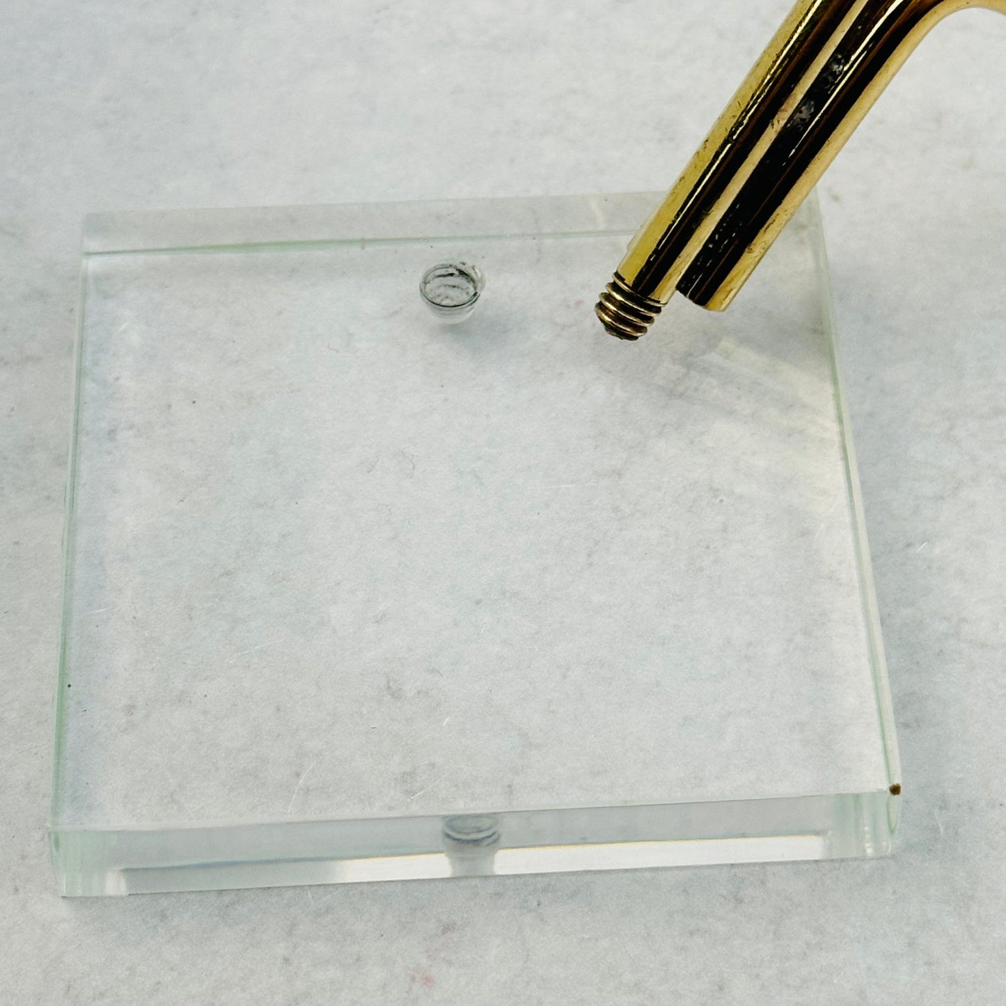 brass holder needs to be screwed in to the base