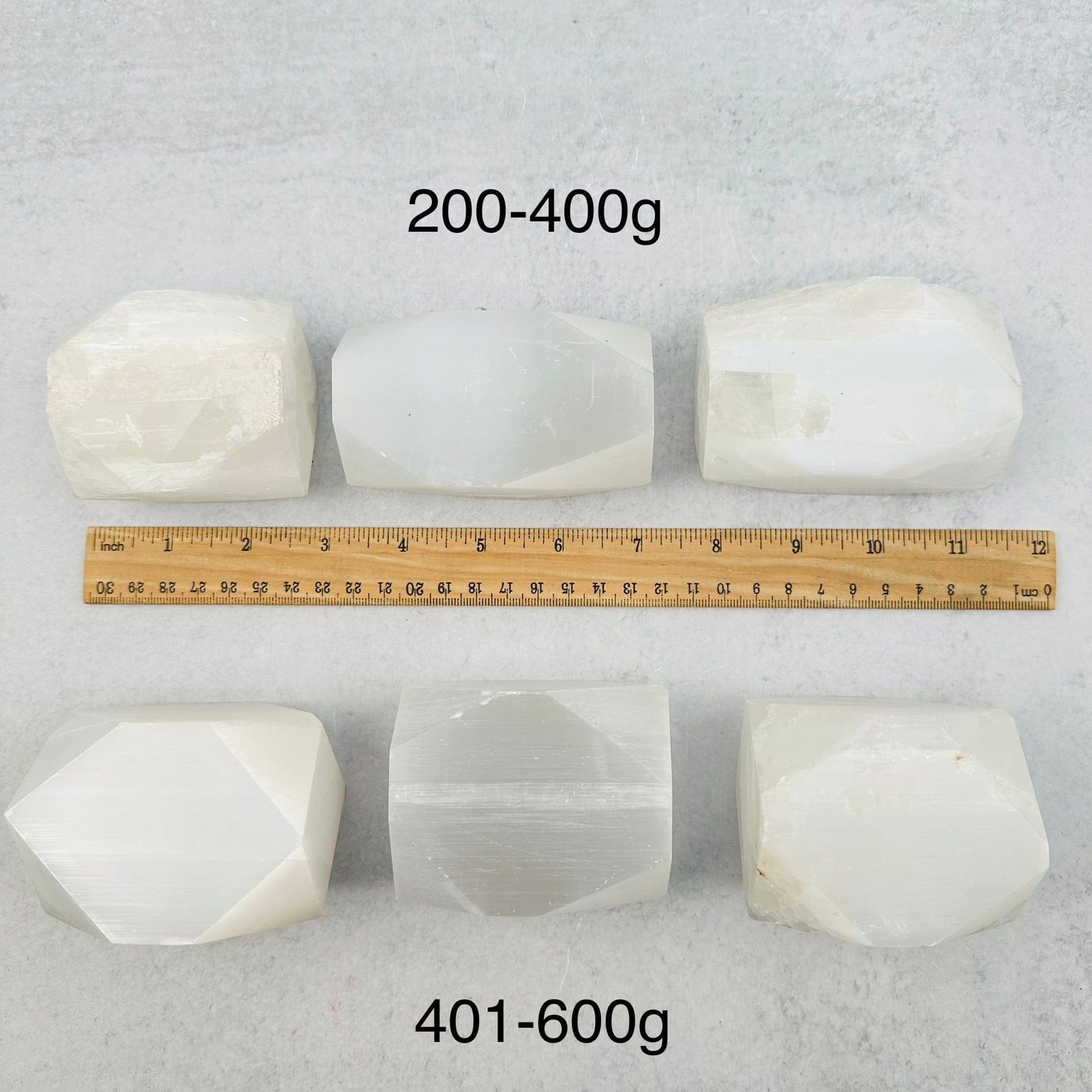 selenite next to a ruler for size reference 