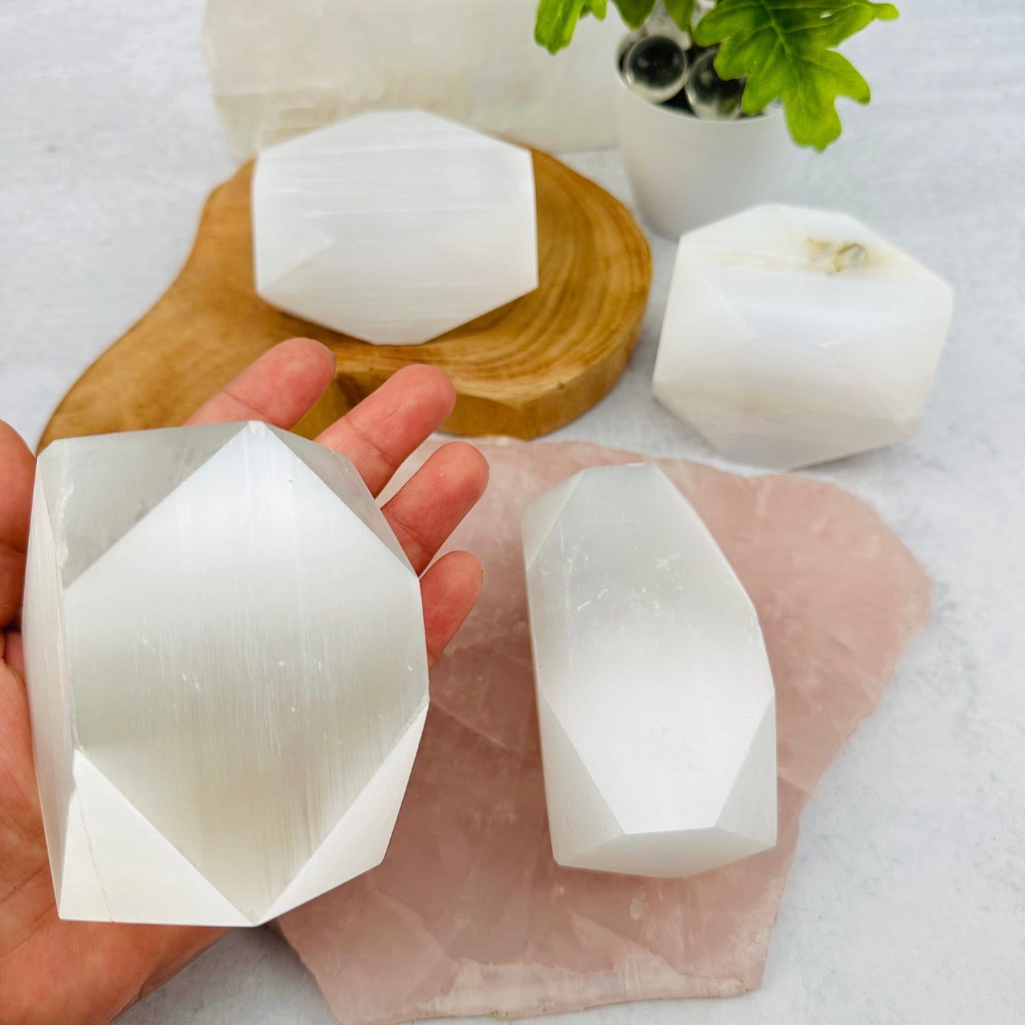 Selenite - Tumbled Polygon Shape in hand for size reference 