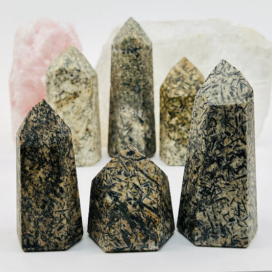 Epidote Polished Crystal Points displayed to show the differences in the sizes and color shades 