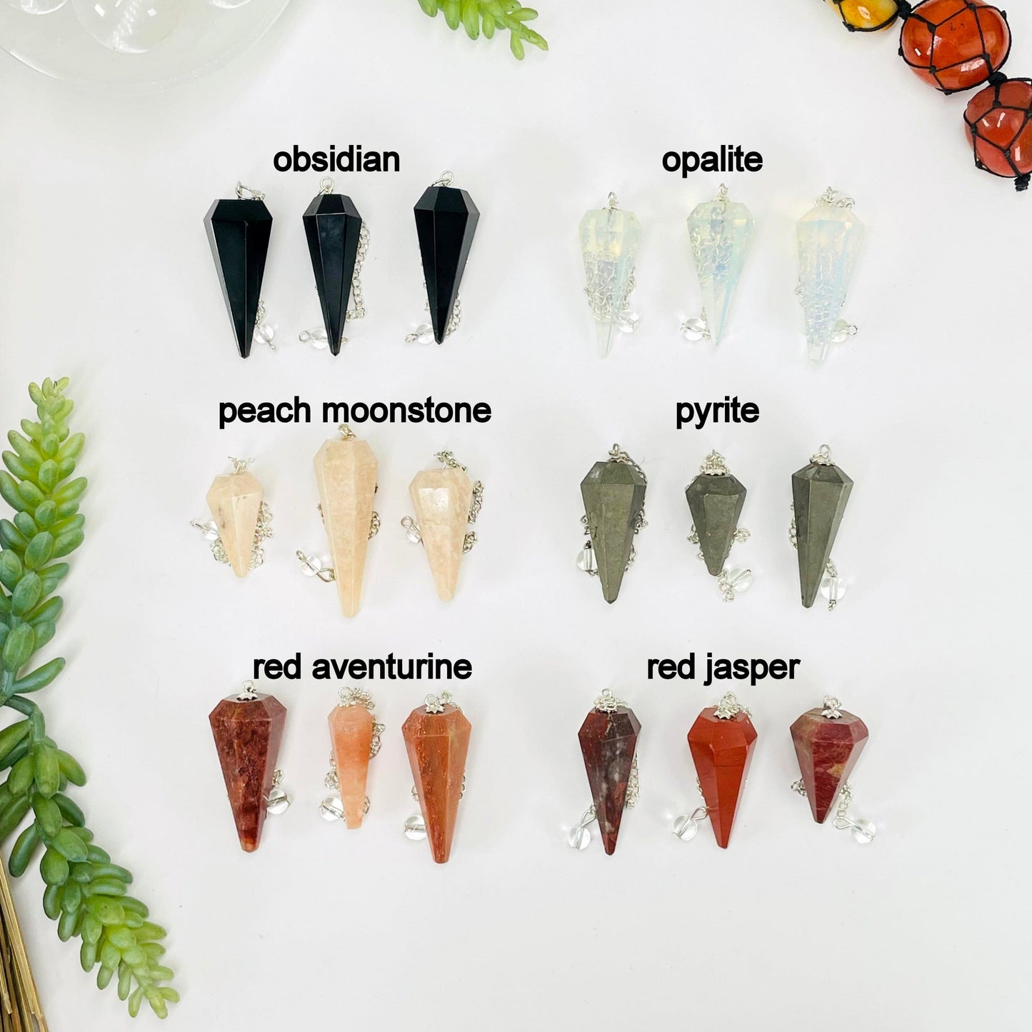 three obsidian, opalite, peach moonstone, pyrite, red aventurine, and red jasper pendulum pendants on white background for possible variations